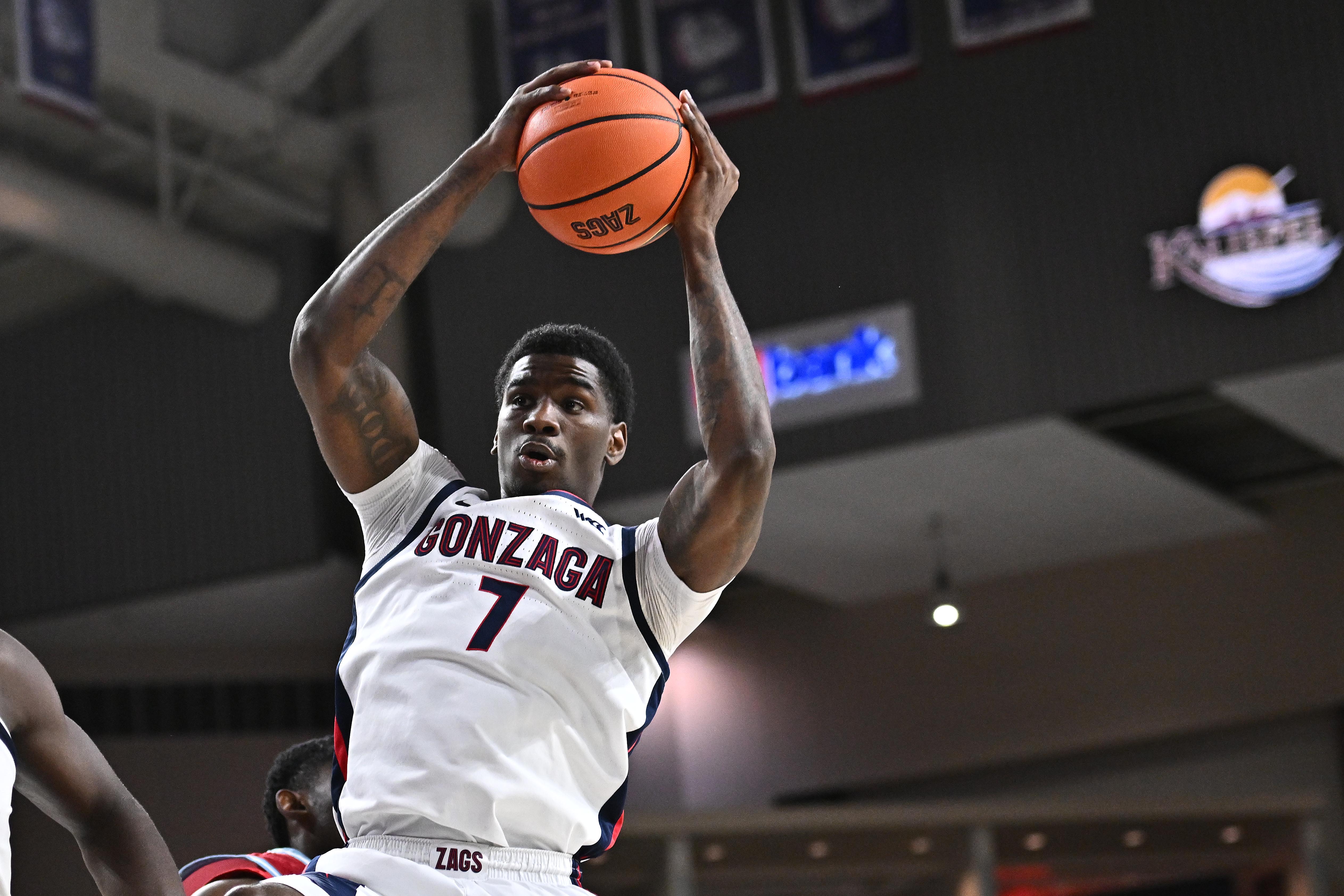 Gonzaga Bulldogs guard Tyon Grant-Foster rebounds the ball as we make our best Santa Clara vs. Gonzaga predictions.