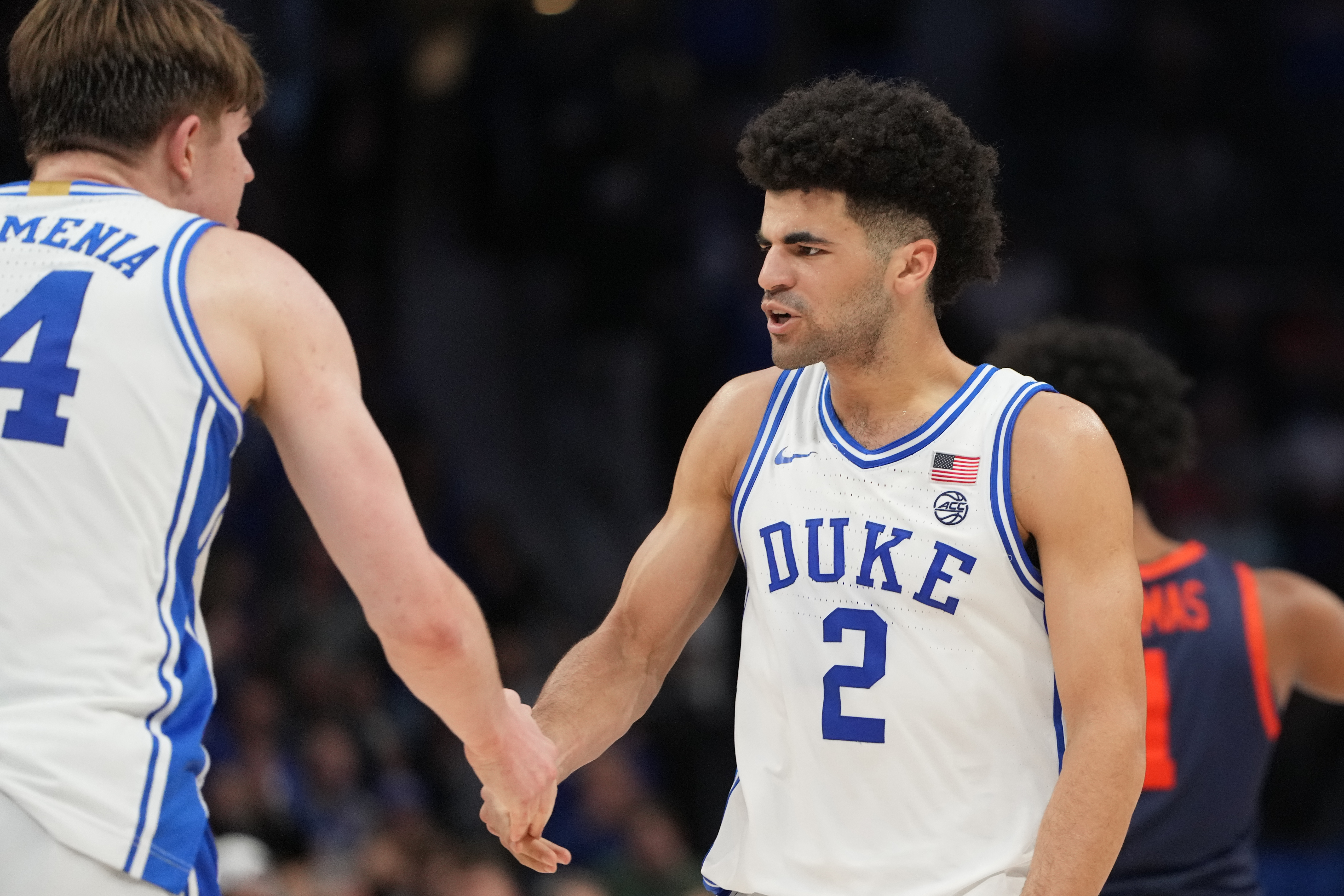 Duke Blue Devils guard Cayden Boozer (2) and guard Nikolas Khamenia (14) react as we break down our Siena vs. Duke prediction.