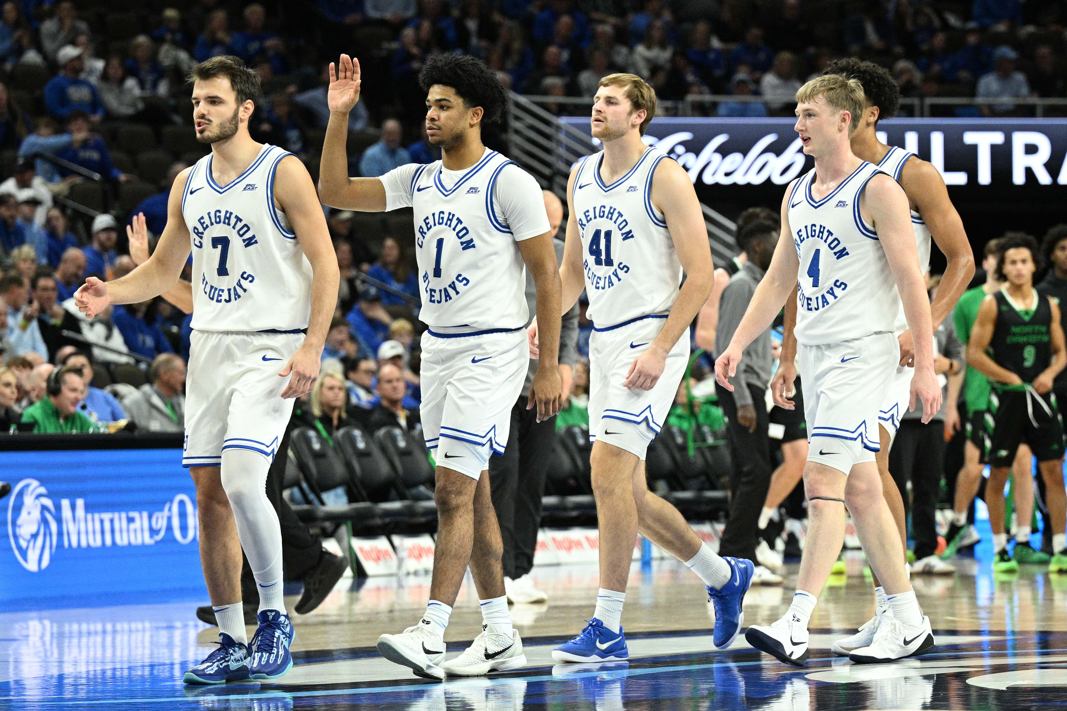 Creighton Bluejays guard Fedor Zugic, guard Zach Kraft, forward Isaac Traudt, and guard Josh Dix walk off the court as we make our college basketball best bets today