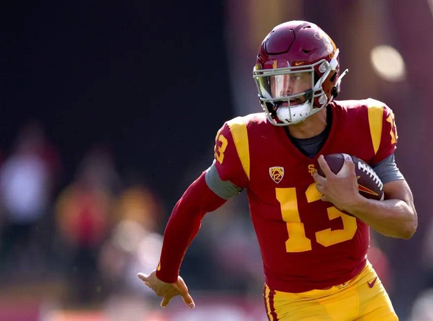 Caleb Williams of the USC Trojans scrambles out of the pocket during the second quarter against the Rice Owls.