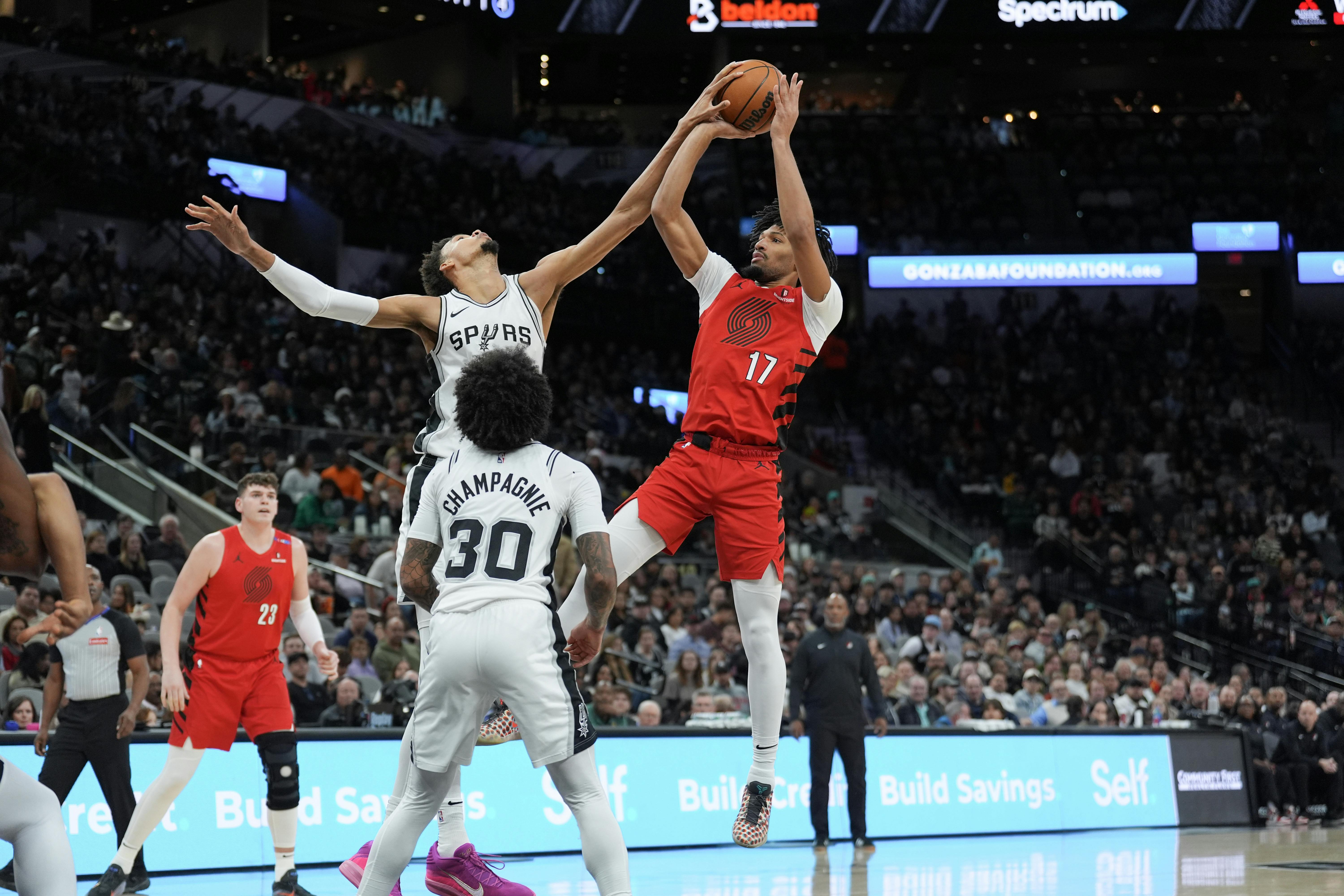 San Antonio Spurs center Victor Wembanyama blocks a shot by Portland Trail Blazers guard Shaedon Sharpe. Wembanyama leads the NBA Defensive Player of the Year odds.