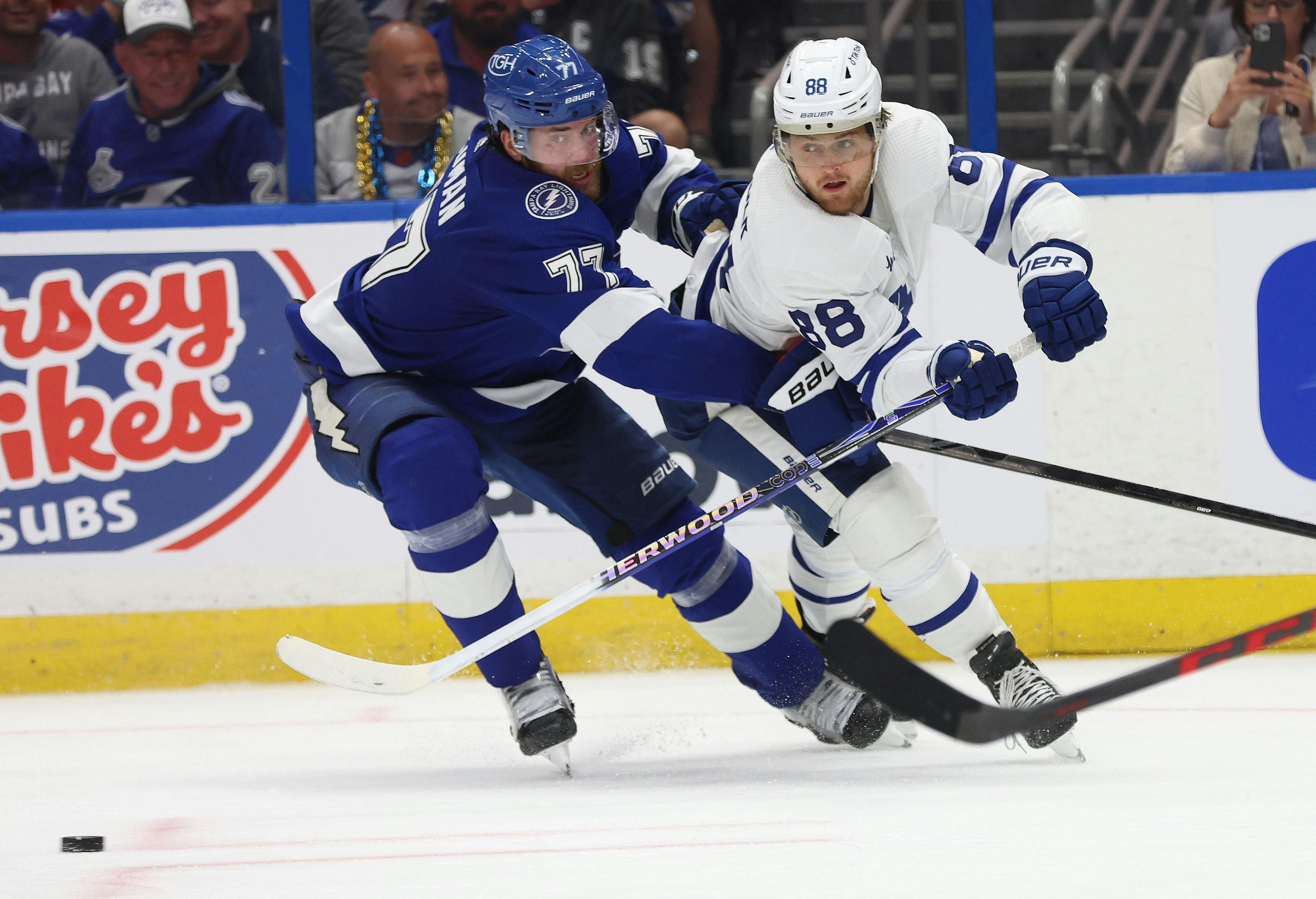 Tampa Bay Lightning defenseman Victor Hedman defends Toronto Maple Leafs right wing William Nylander