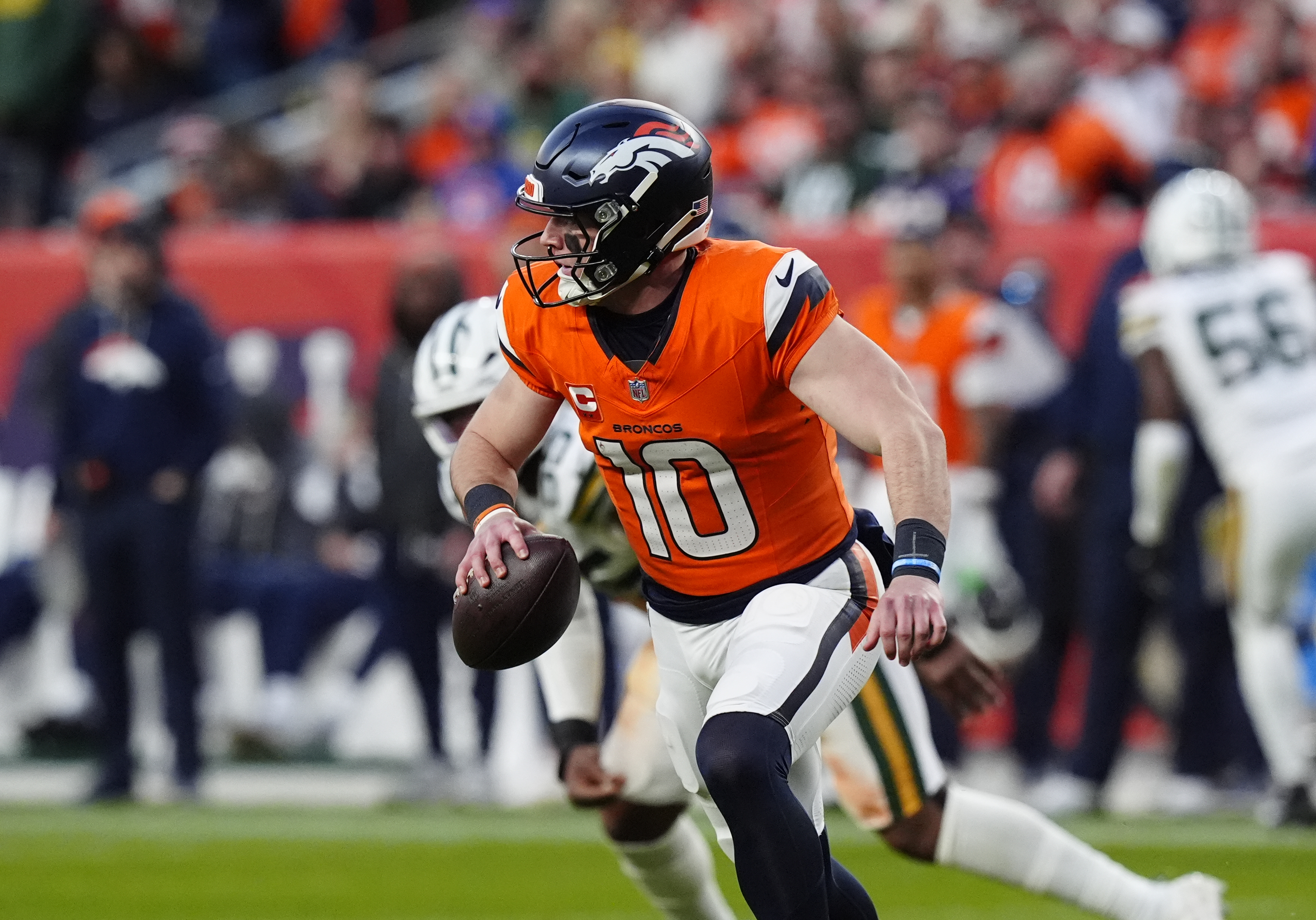 Denver Broncos quarterback Bo Nix (10) runs in the pocket as we look at the Thursday Night Football odds for Week 17