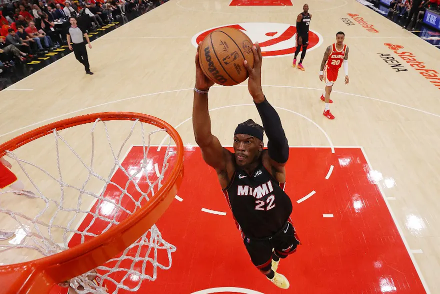 Jimmy Butler of the Miami Heat dunks against the Atlanta Hawks as we look at our NBA parlay picks for Tuesday