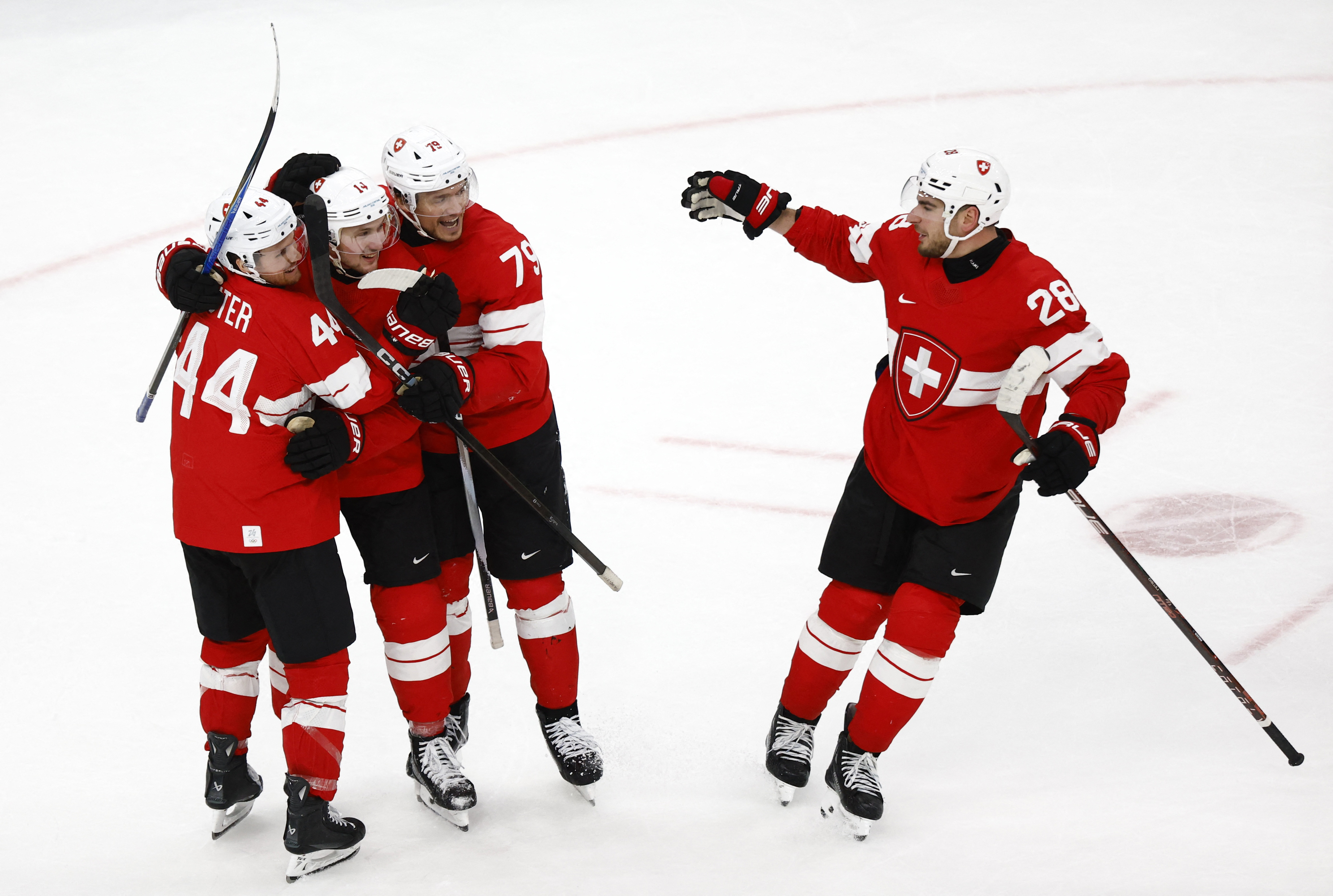 Switzerland teammates celebrate a goal as we provide our Switzerland vs. Italy prediction.