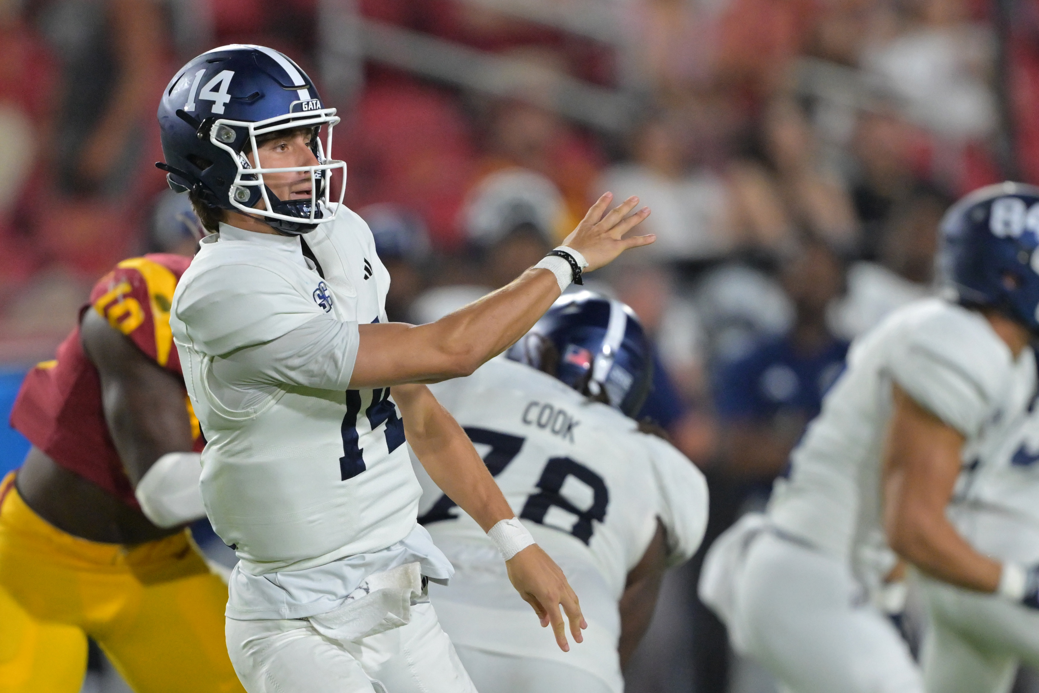 Georgia Southern quarterback Turner Helton (14) sets to pass as we look at our college football bowl game predictions