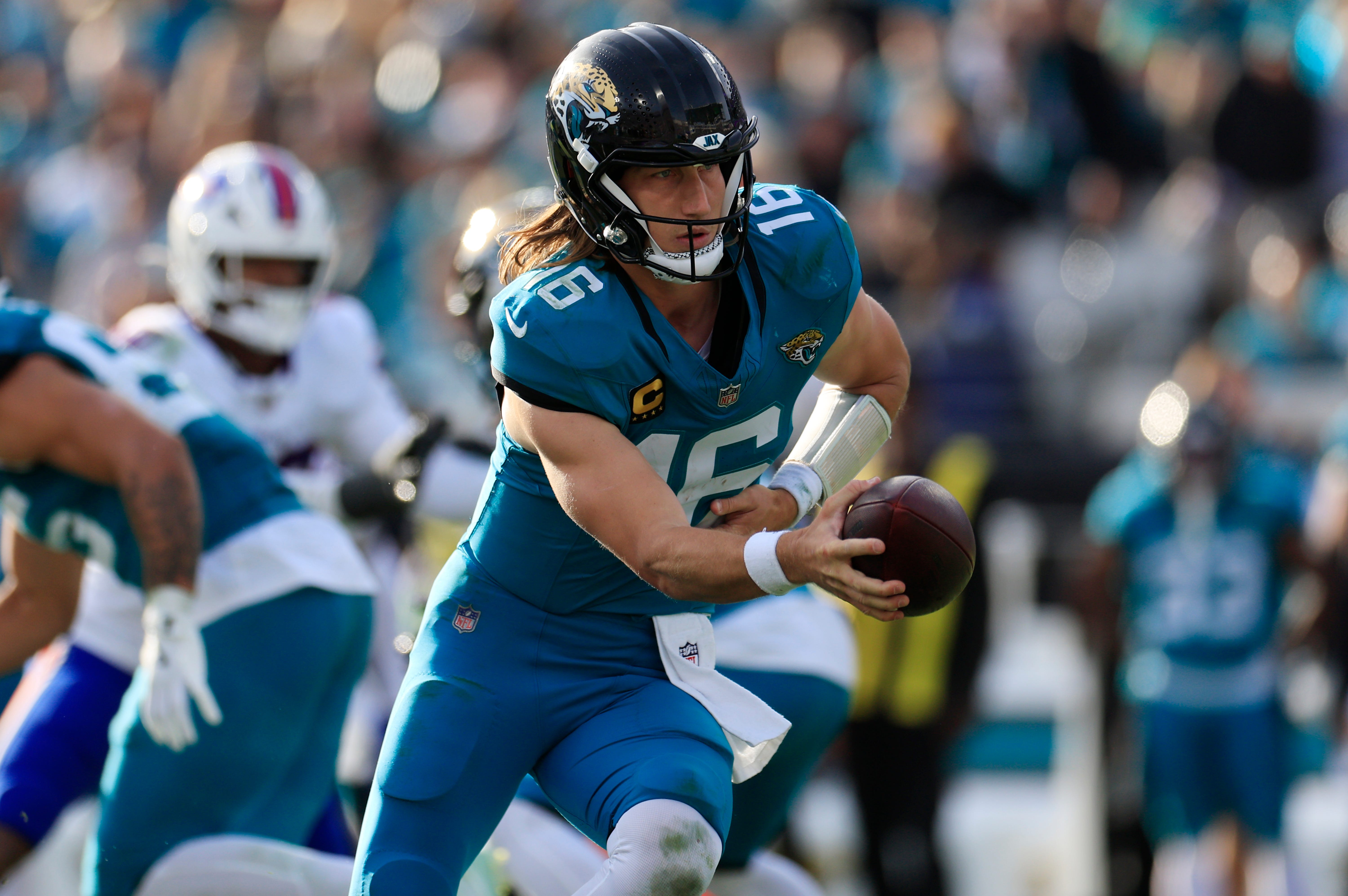 Jacksonville Jaguars quarterback Trevor Lawrence looks to hand off as we make our best NFL Survivor picks for Week 1.