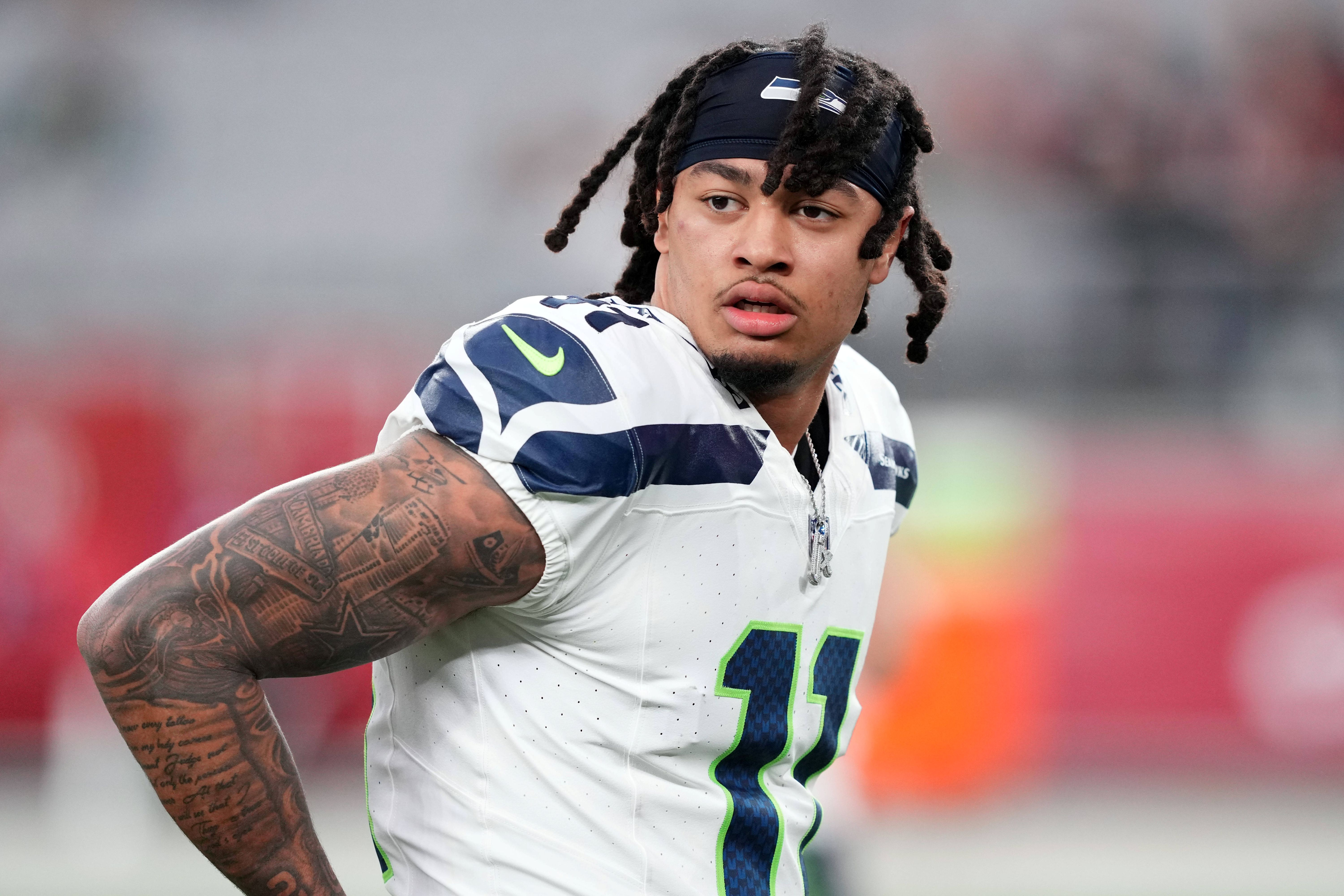 Seattle Seahawks wide receiver Jaxon Smith-Njigba looks on, and he's key as we analyze the look-ahead betting lines