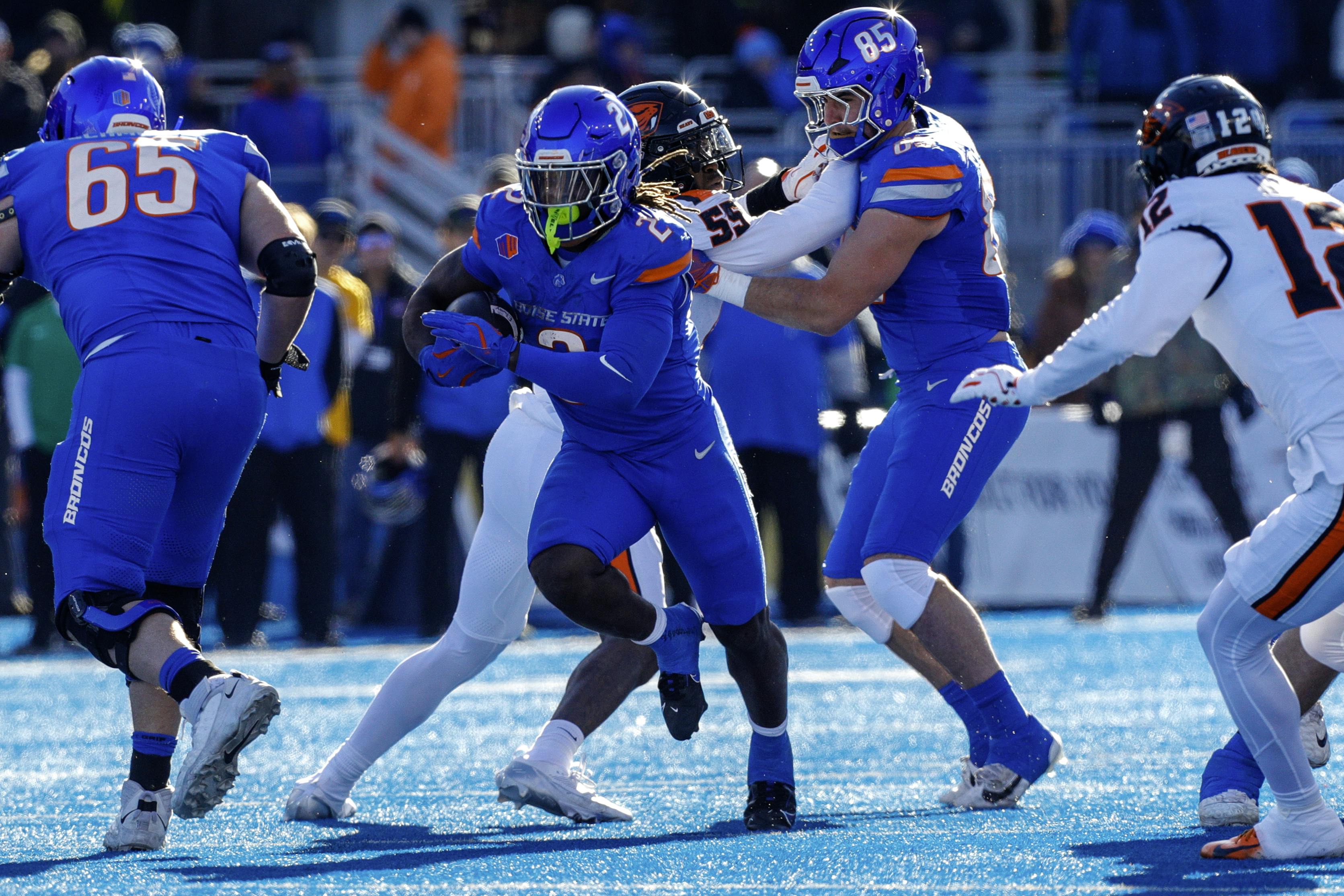 Boise State running back Ashton Jeanty runs up the middle against Oregon State. Jeanty is second in the Heisman Trophy odds.