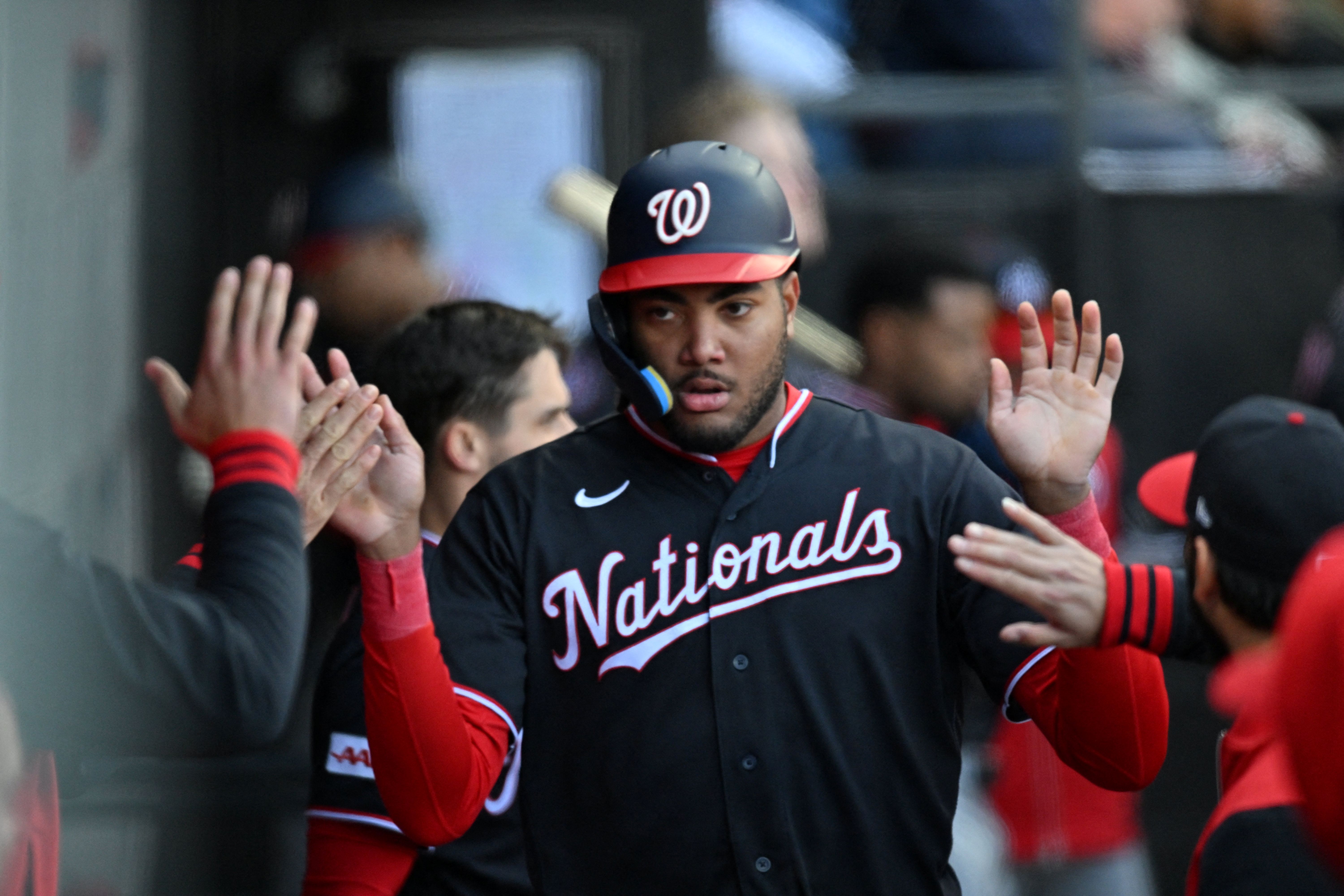Washington Nationals left fielder James Wood celebrates in the dugout, and he's key as we look at the Twins vs. Nationals win probability.