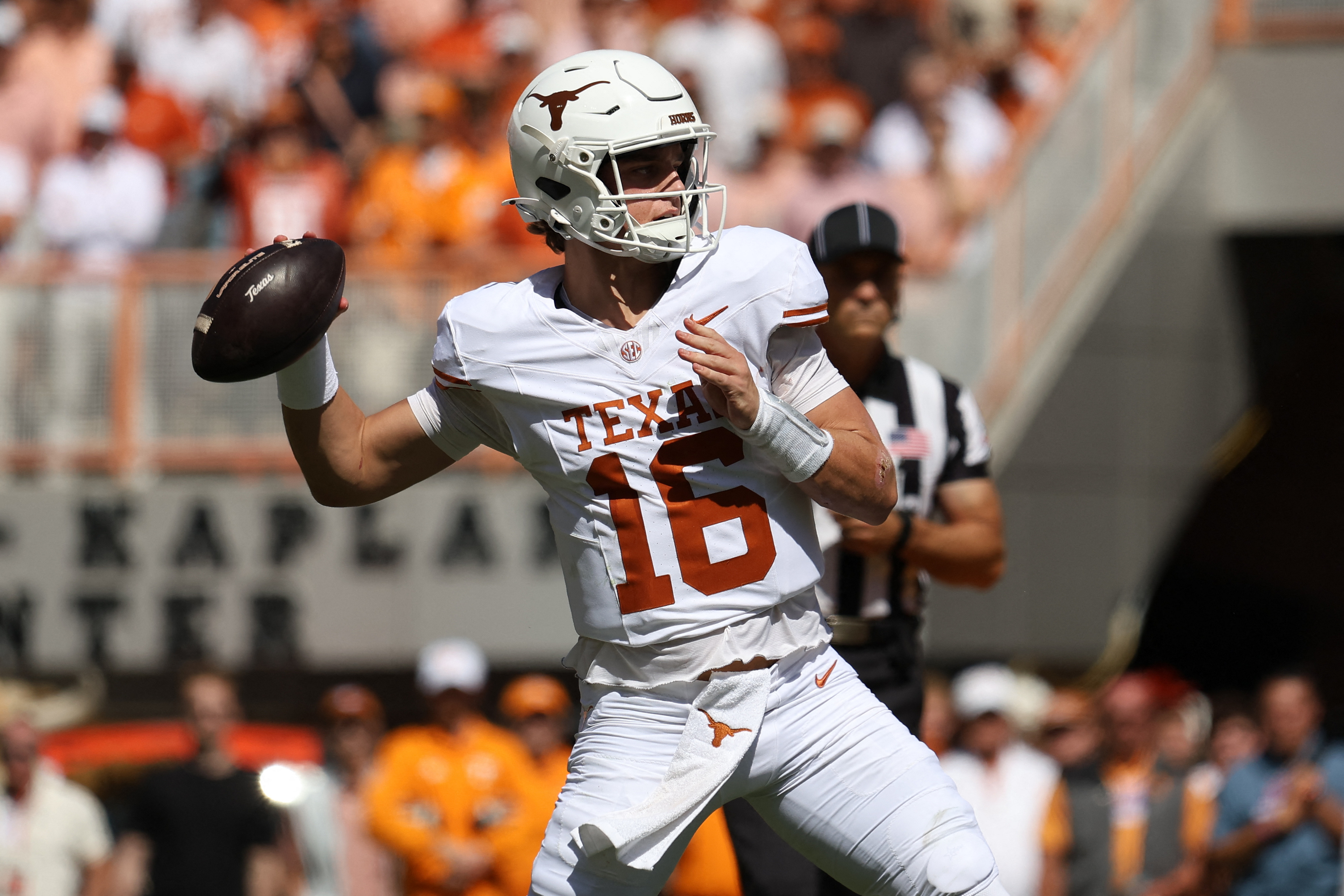 Pictured: Texas quarterback Arch Manning throwing a pass as we break down our College Football Week 6 AI Predictions. Photo by Randy Sartin-Imagn Images.
