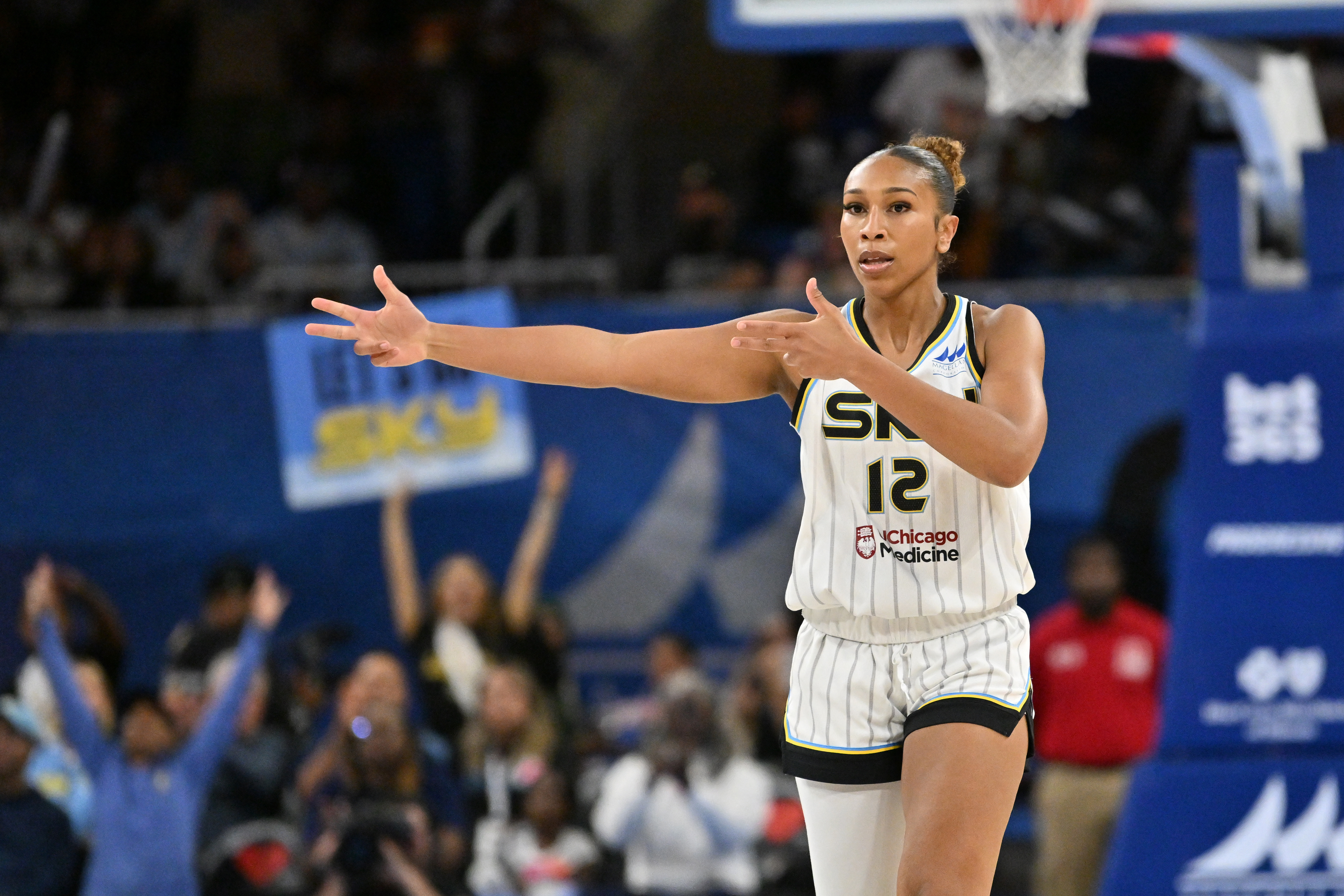Chicago Sky guard Sydney Taylor (12) celebrates as she is featured in our Fever vs. Sky prediction.