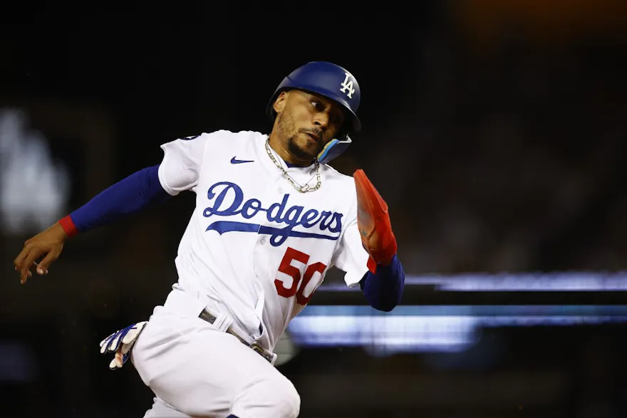 Mookie Betts of the Los Angeles Dodgers scores a run against the Minnesota Twins in the fifth inning at Dodger Stadium.