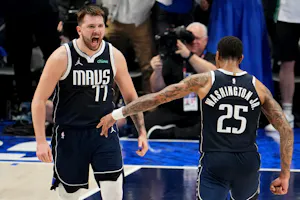 Luka Doncic and P.J. Washington of the Dallas Mavericks celebrate during Game 3 of the Western Conference Finals. We're backing Doncic in our Mavericks vs. Timberwolves Parlay. 