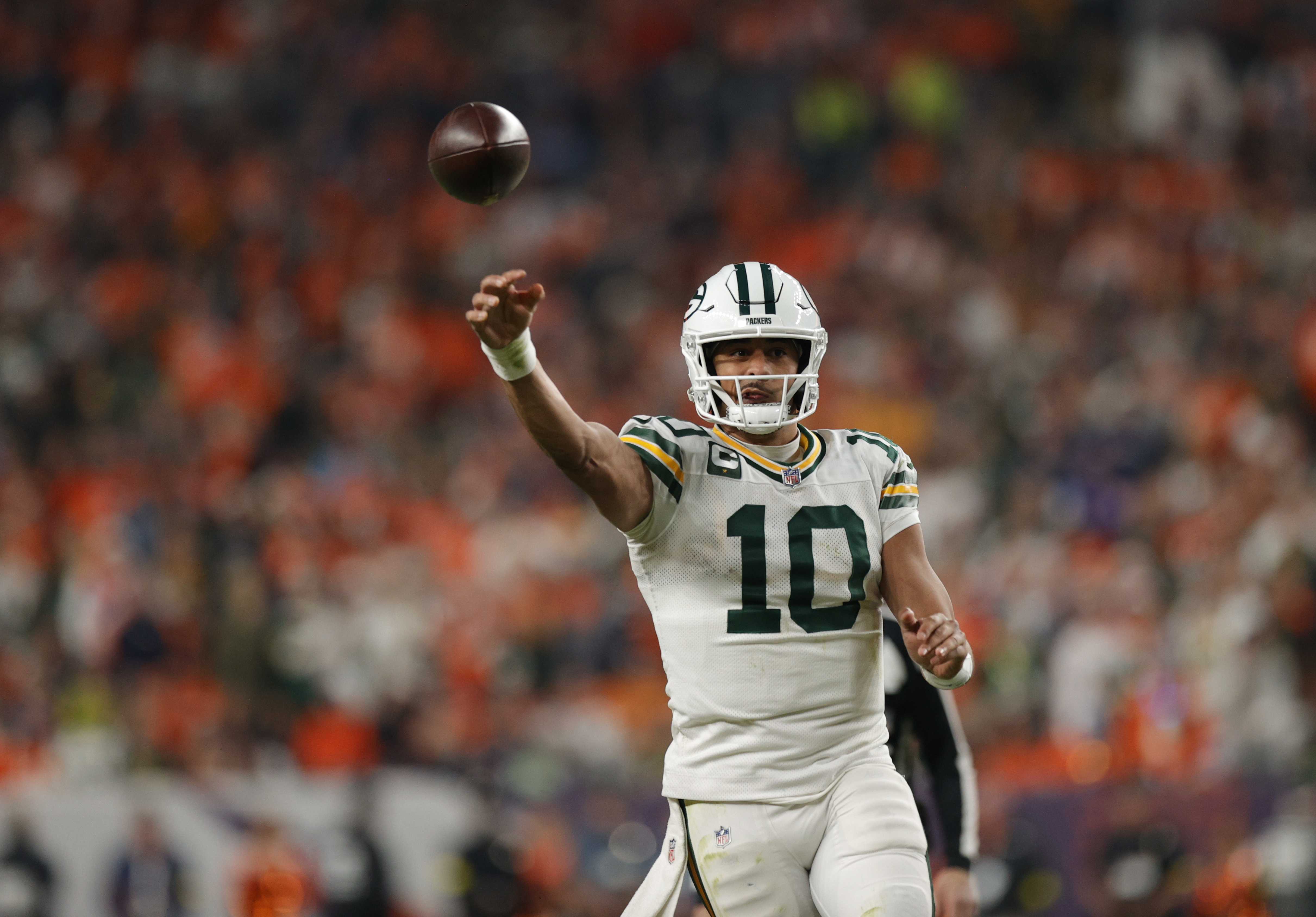 Green Bay Packers quarterback Jordan Love (10) throws downfield as we offer our Ravens vs. Packers predictions.
