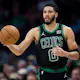 Jayson Tatum of the Boston Celtics brings the ball upcourt in the third quarter during their game against the Charlotte Hornets as we look at our Celtics-Cavaliers player props.