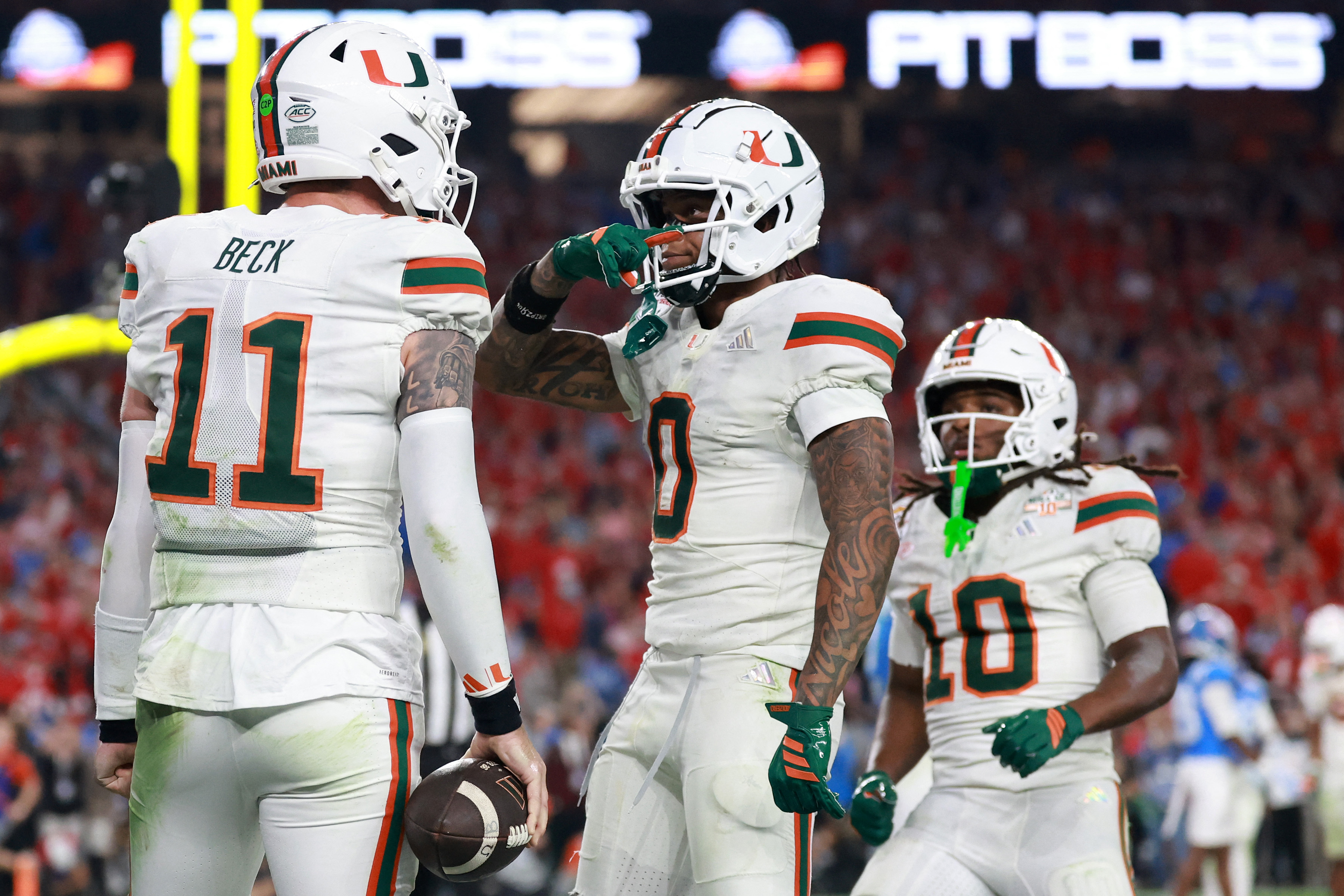 Miami's Carson Beck (11), Malchi Toney (10), and Keelan Marion (0) are key to how Miami will win the CFP National Championship against Indiana.