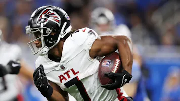 Bijan Robinson of the Atlanta Falcons runs with the ball in the first half of a game against the Detroit Lions, and we offer our top Bijan Robinson player props based on the best NFL odds.