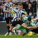 Fulham's Aleksandar Mitrovic pulls down Newcastle's Kieran Trippier.