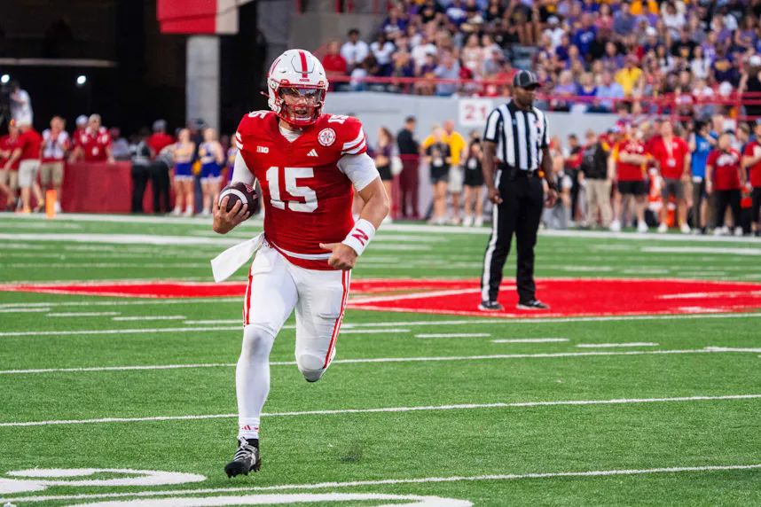 Nebraska Cornhuskers quarterback Dylan Raiola (15) runs as we offer our Week 4 college football player prop bets.