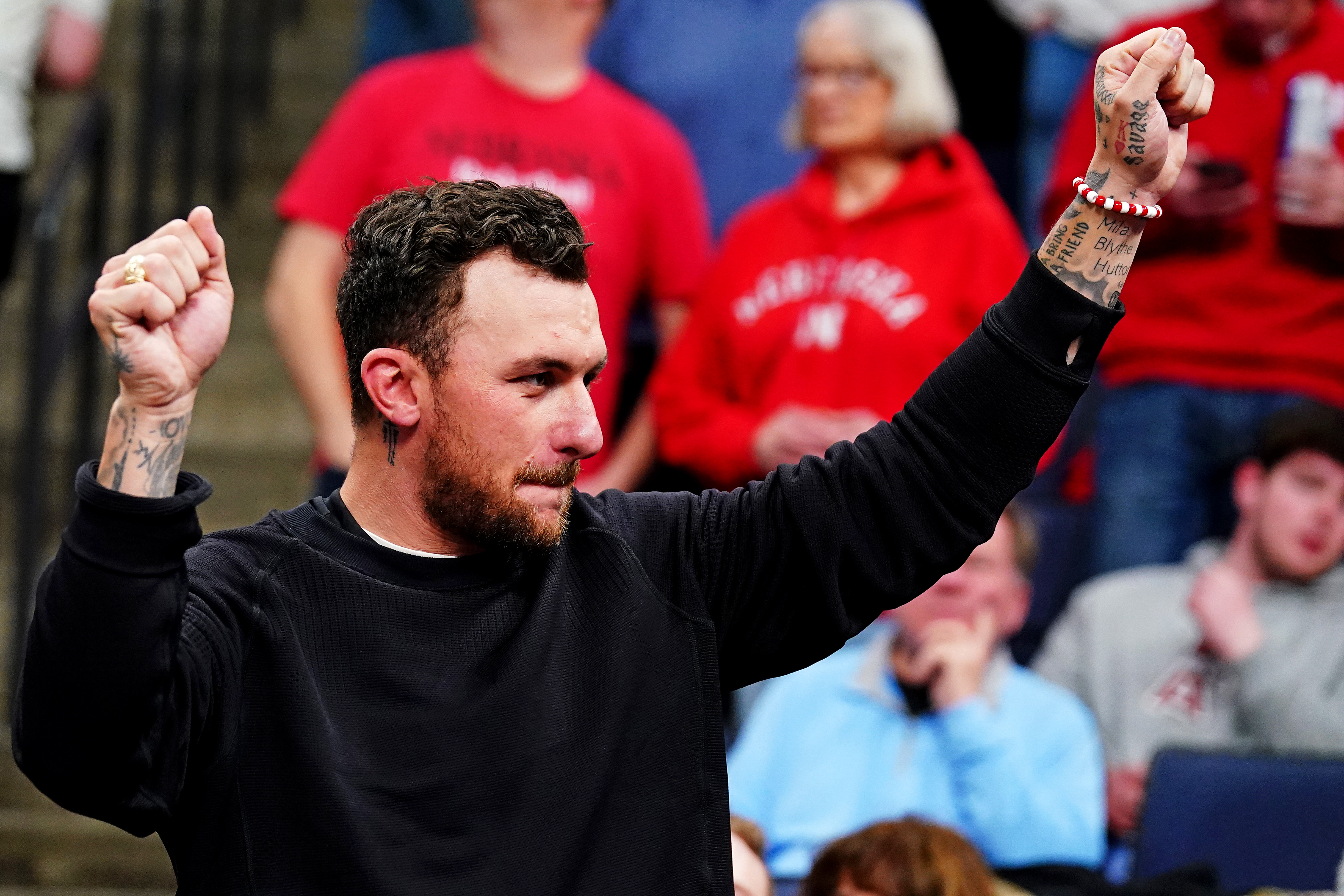  Former Texas A&M Aggies QB Johnny Manziel watches a game as we look at his marketing of Kalshi.