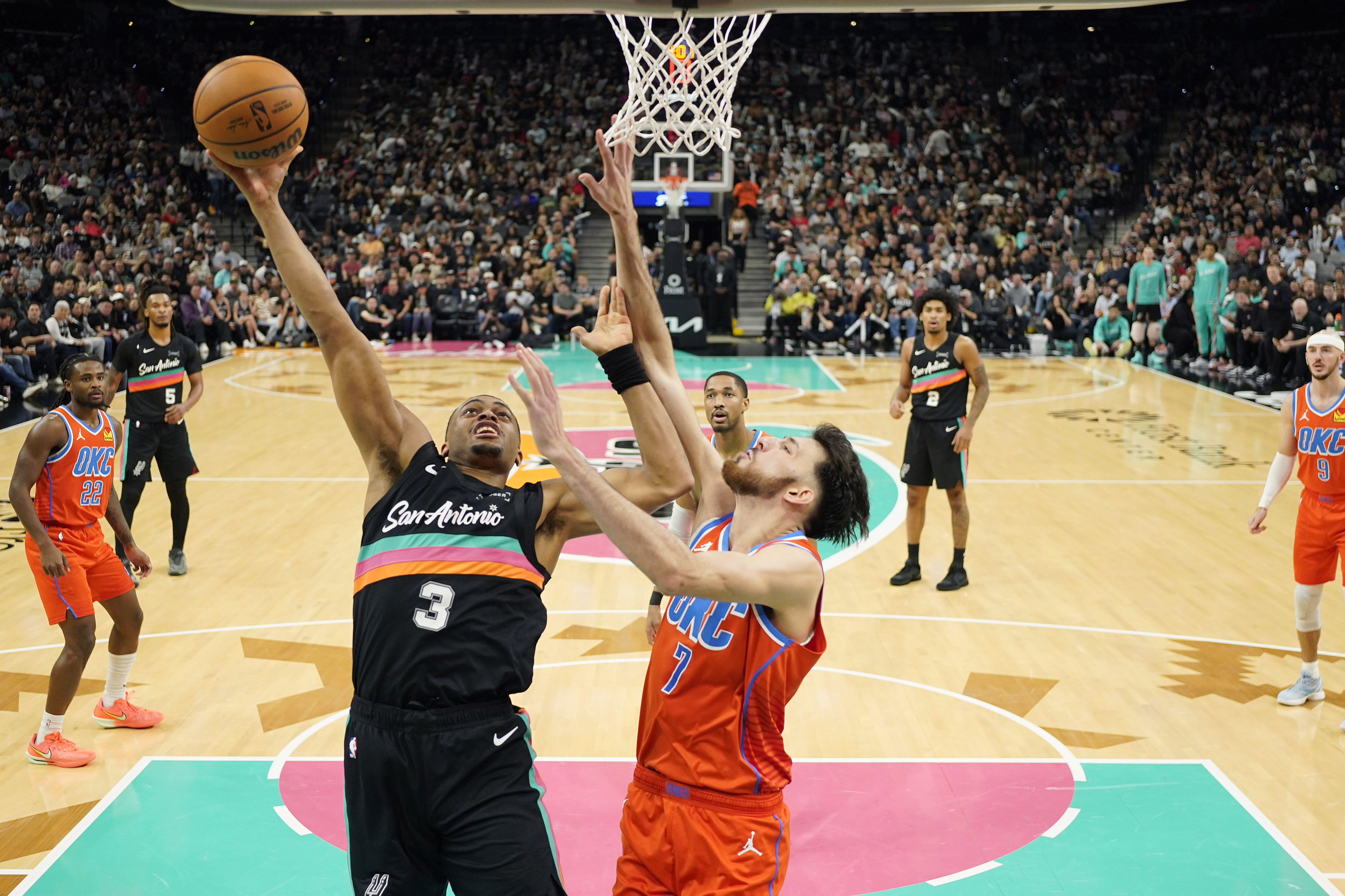 San Antonio Spurs forward Keldon Johnson drives to the basket as we make our best Spurs vs. Thunder player props for Christmas Day.
