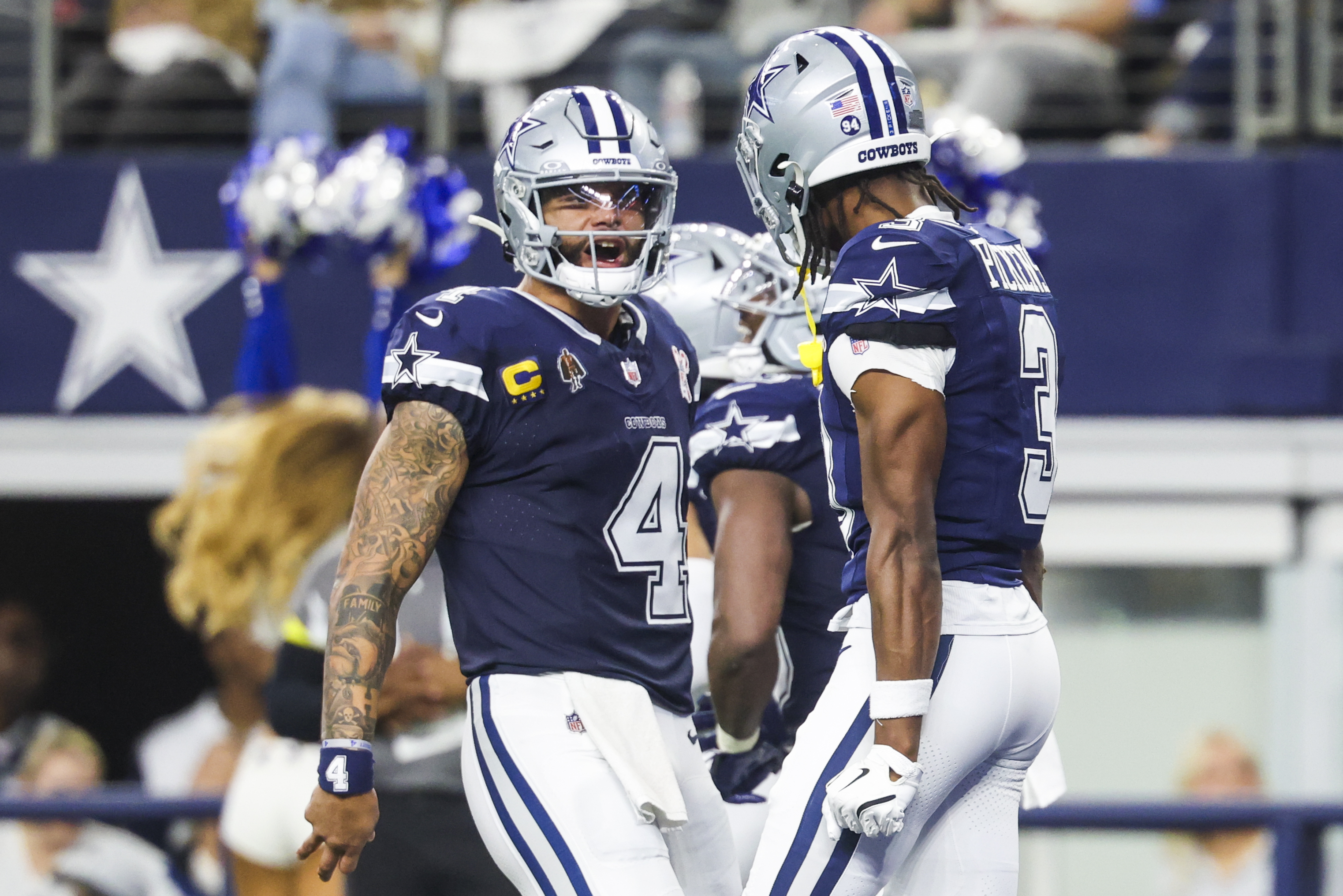 Dallas Cowboys quarterback Dak Prescott (4) celebrates with wide receiver George Pickens (3) following a touchdown pass as we look at our early Cowboys vs. Commanders prediction