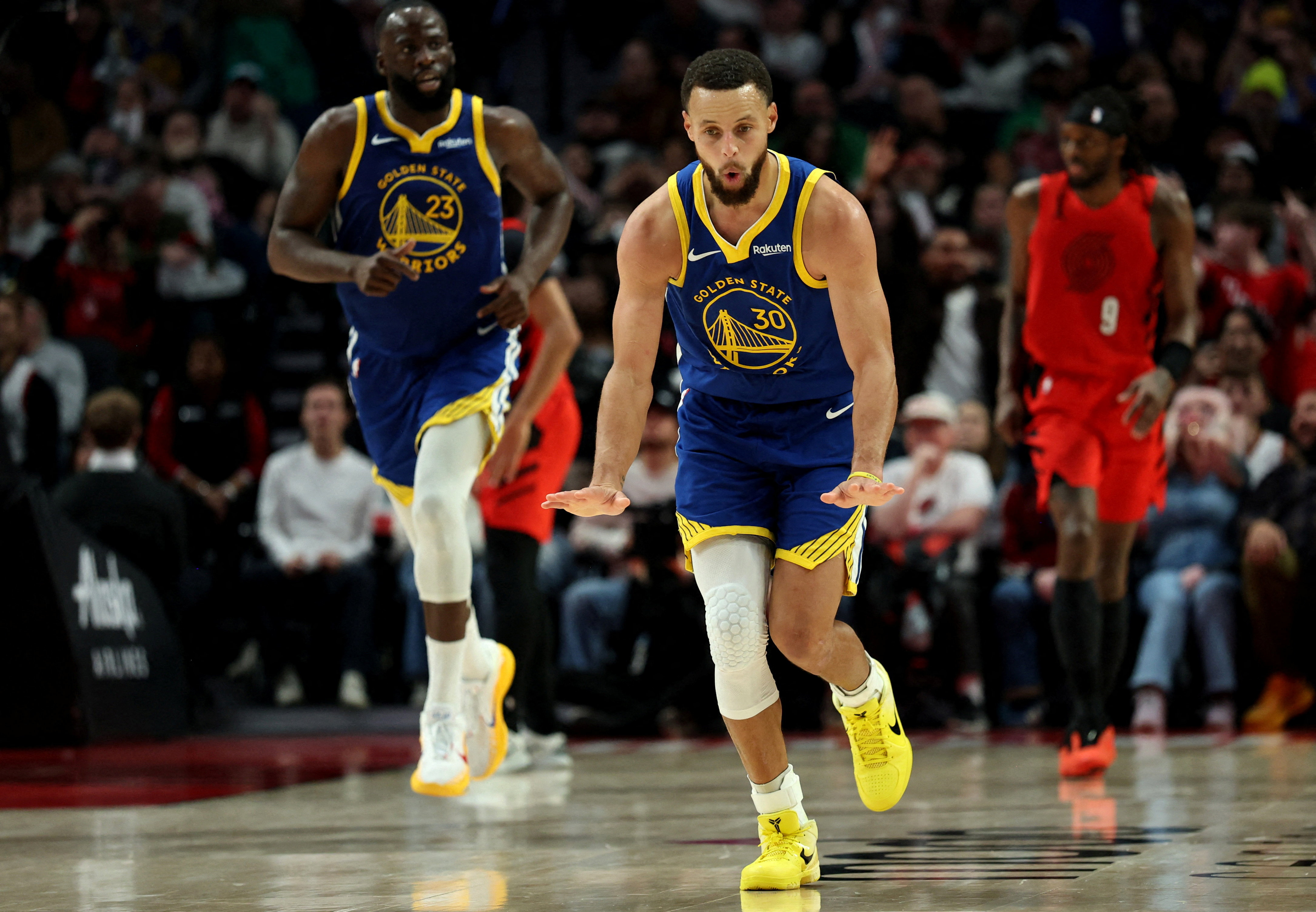Golden State Warriors guard Stephen Curry (30), who is featured in our Trail Blazers vs. Warriors player props, reacts after making a three-point shot.