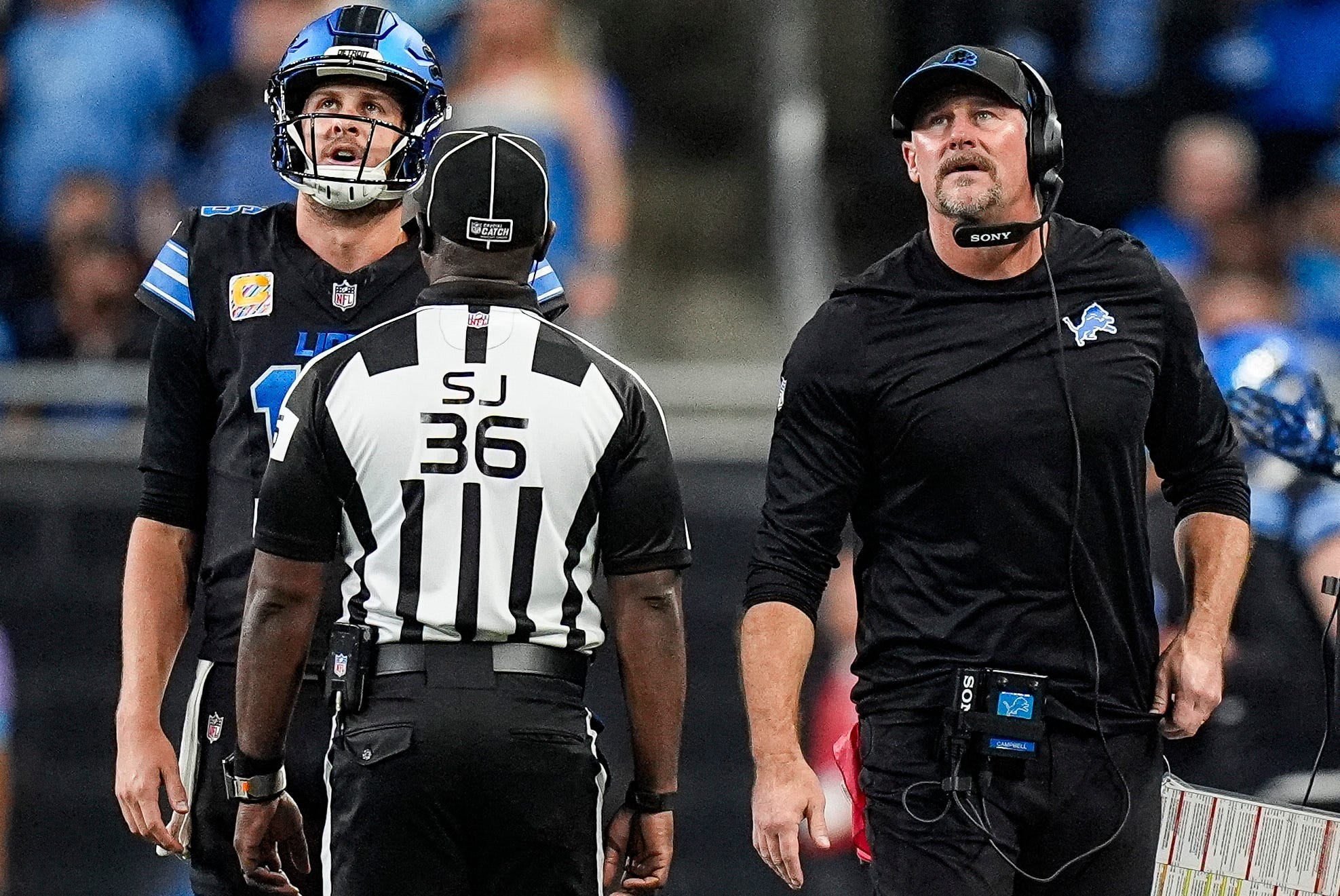 Detroit Lions quarterback Jared Goff (16), left, and head coach Dan Campbell talks to a referee regarding a play against the Green Bay Packers as we make our best Week 8 NFL moneyline prediction. 