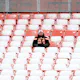 A Cleveland Browns fan sits in the stands during the game against the New Orleans Saints at FirstEnergy Stadium on December 24, 2022. Photo by Nick Cammett Getty Images via AFP.