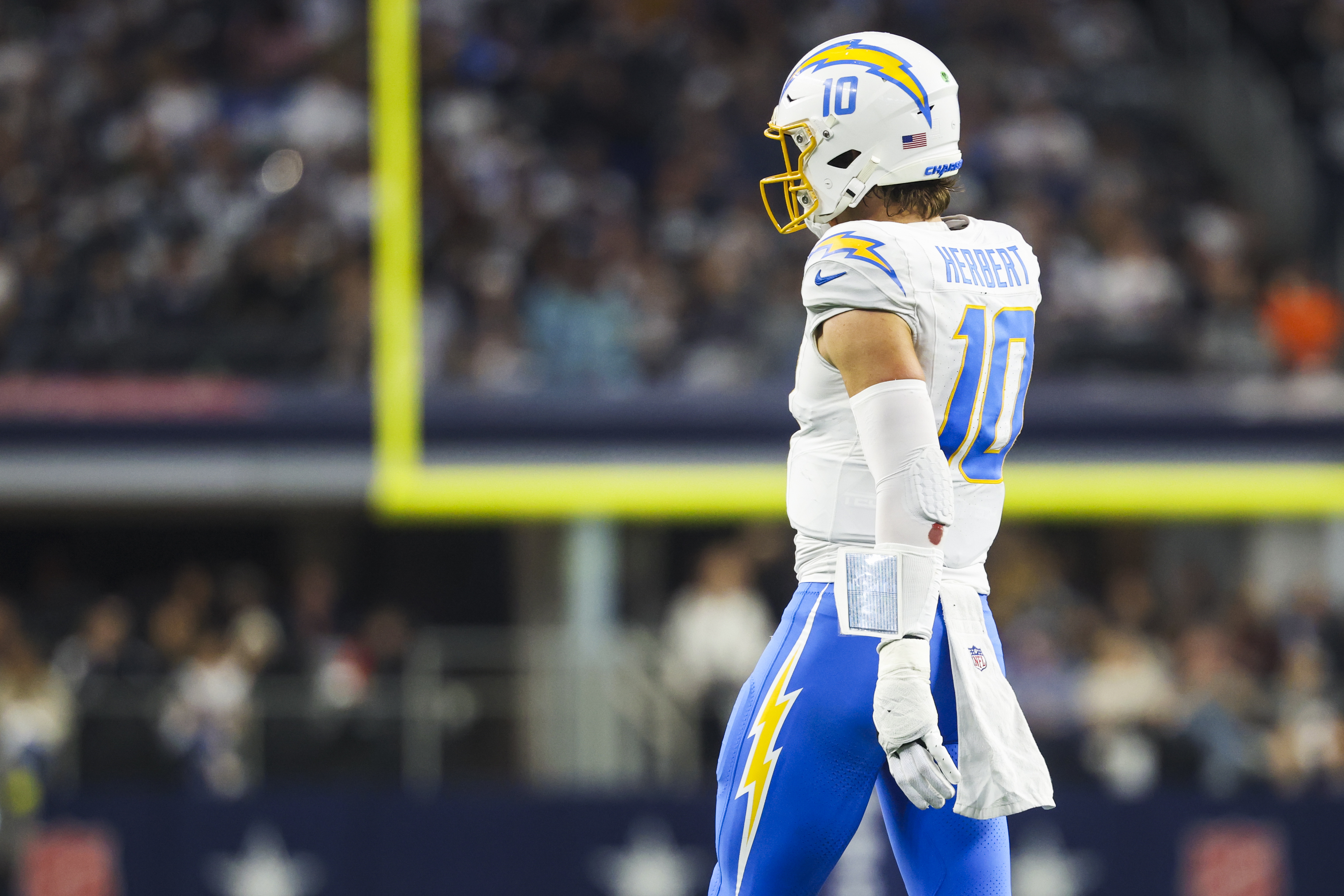 Los Angeles Chargers quarterback Justin Herbert (10) looks towards the sideline as he is featured in our Texans vs. Chargers predictions & opening odds.