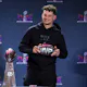 Quarterback Patrick Mahomes #15 of the Kansas City Chiefs poses with the MVP award as we look at the American Gaming Association's February report