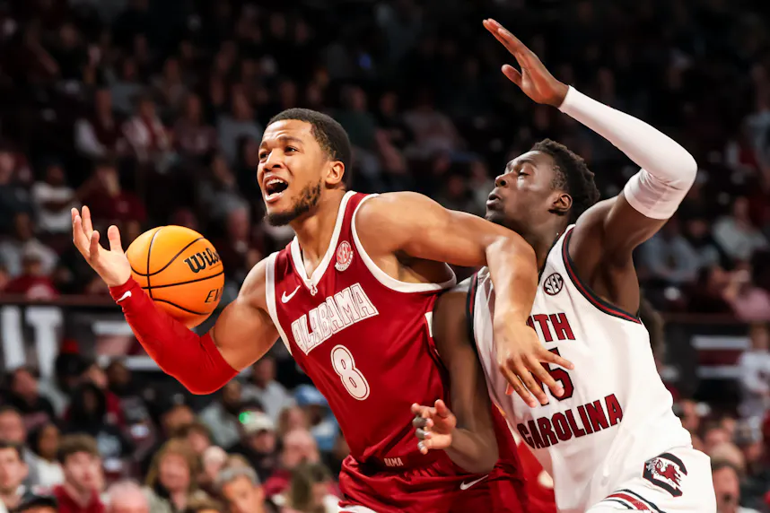 Alabama Crimson Tide guard Chris Youngblood (8) loses the ball as we look at the Alabama vs. Texas A&M odds and our top picks.