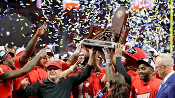 Head coach Kirby Smart of the Georgia Bulldogs celebrate with the trophy as we round up our top college football Week 14 predictions