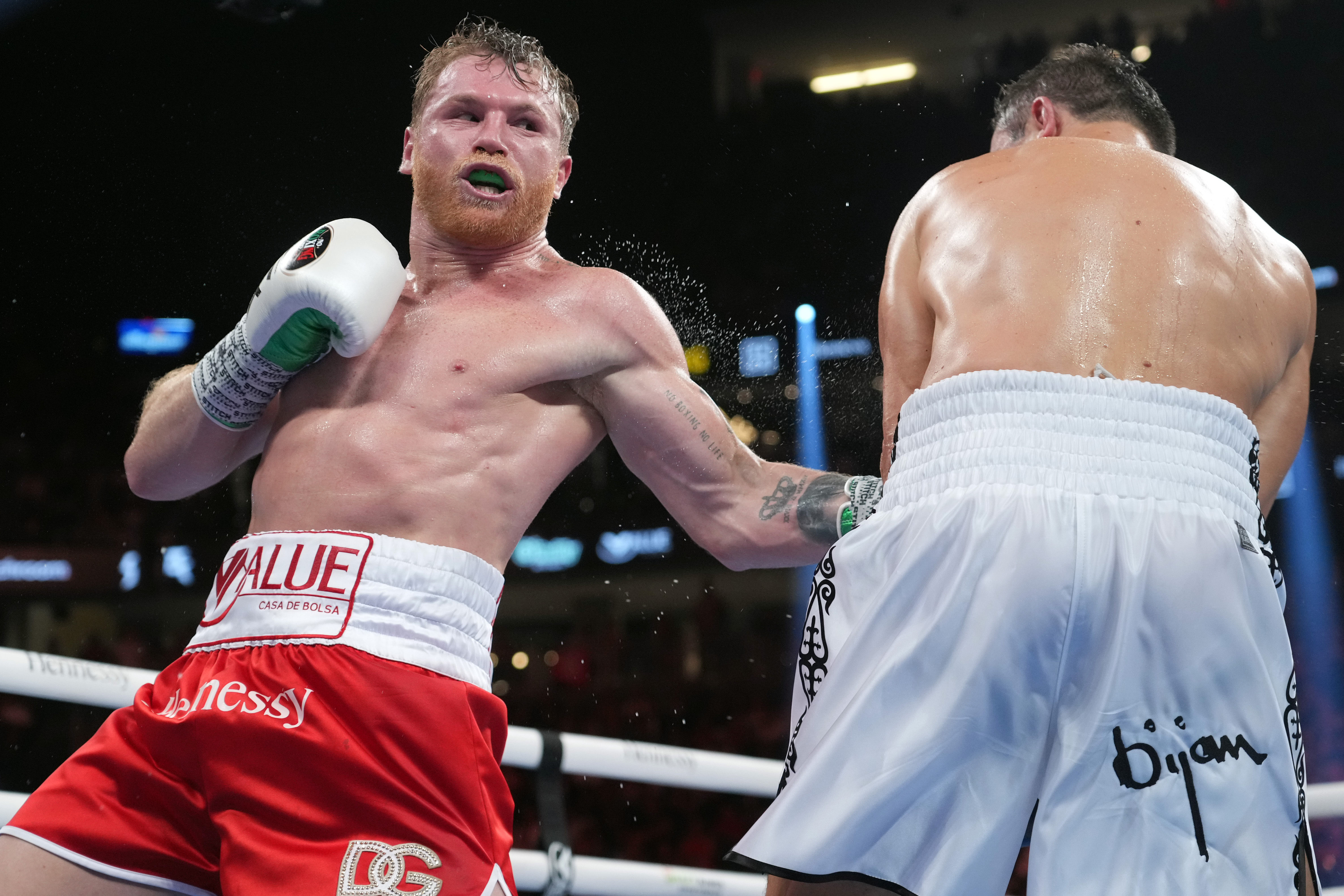 Canelo Alvarez lands a punch as we make our best Canelo Alvarez vs. Christian Mbilli prediction.