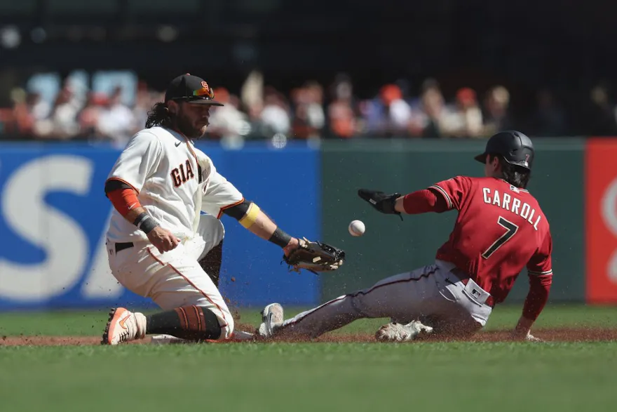 Corbin Carroll of the Arizona Diamondbacks steals second base ahead of Brandon Crawford of the San Francisco Giants and he headlines our top odds and picks for MLB's stolen base leaders in 2023.