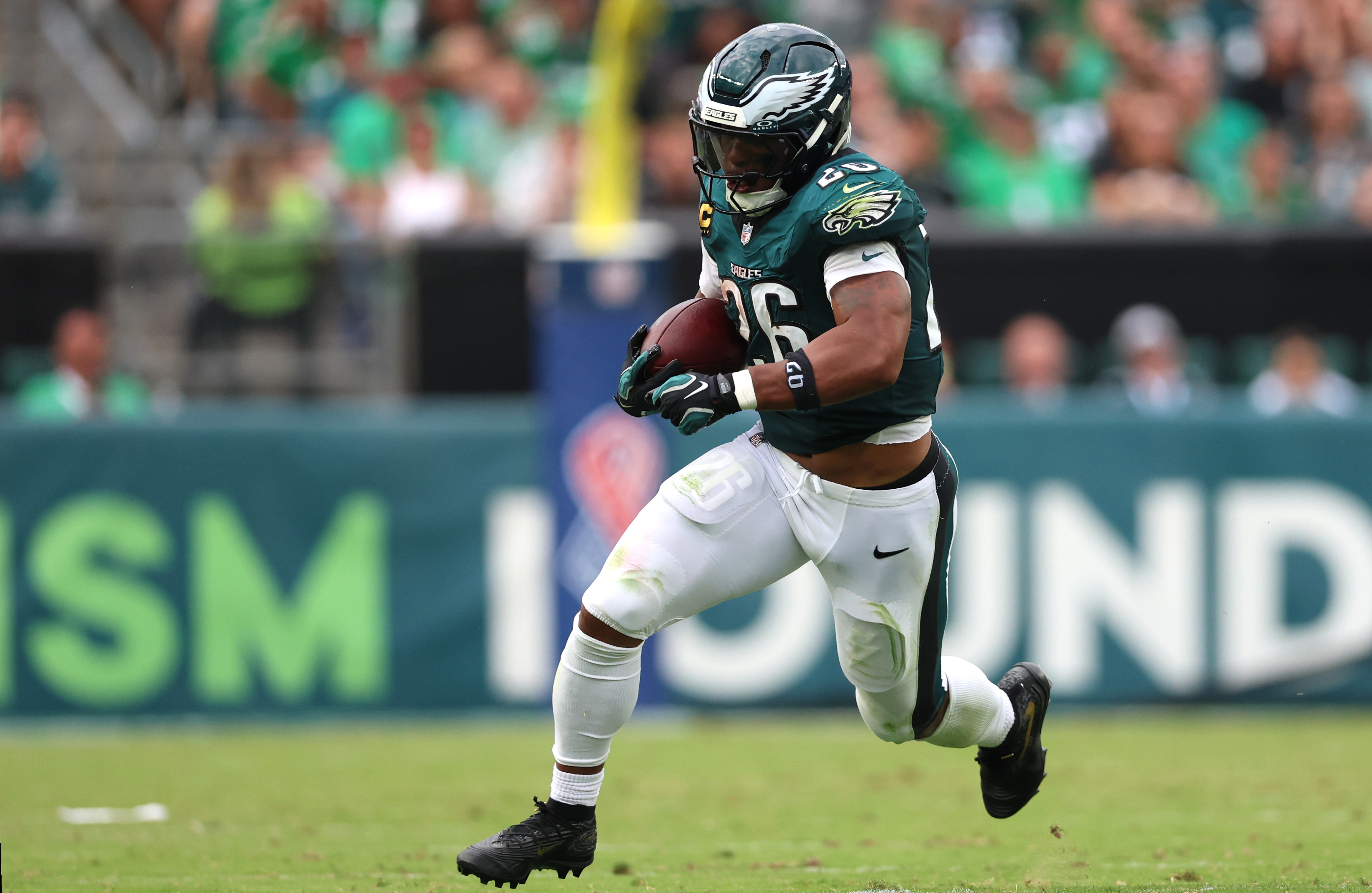 Philadelphia Eagles running back Saquon Barkley (26) runs the ball as he is featured in our NFL 2+ touchdown scorer predictions.