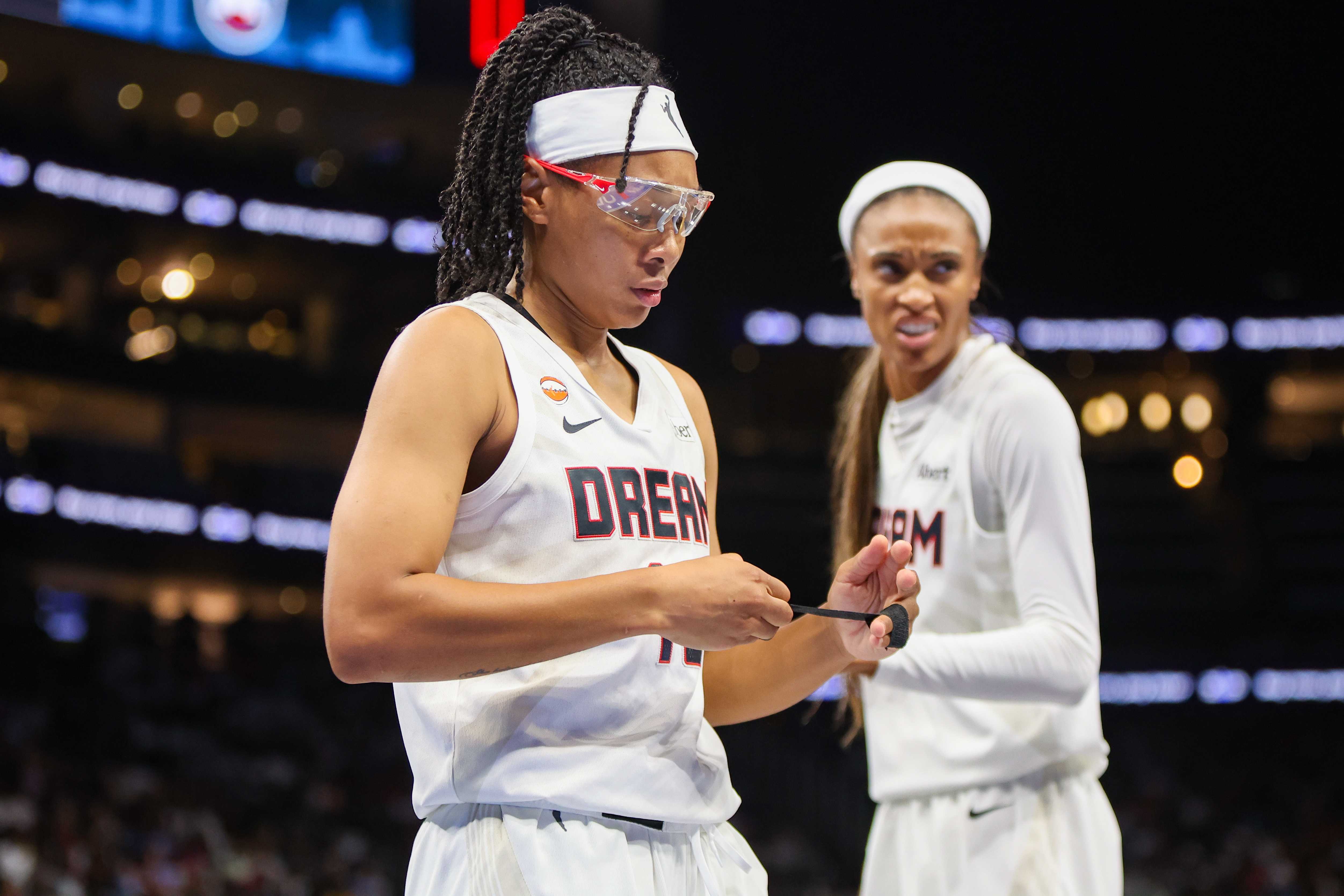 Atlanta Dream guard Allisha Gray (15) adjusts the tape on her fingers as we break down our Valkyries vs. Dream prediction.