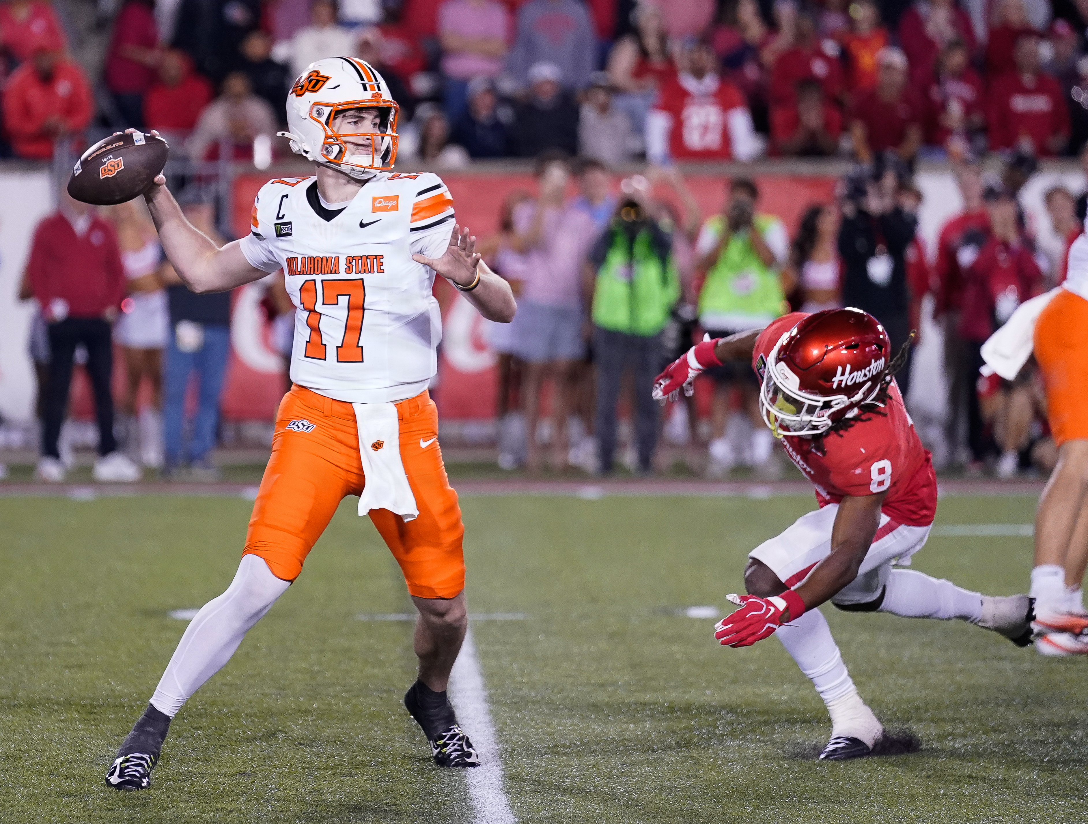 Oklahoma State Cowboys quarterback Drew Mestemaker (17) attempts a pass as he is featured in our Colorado vs. Oklahoma State prediction.