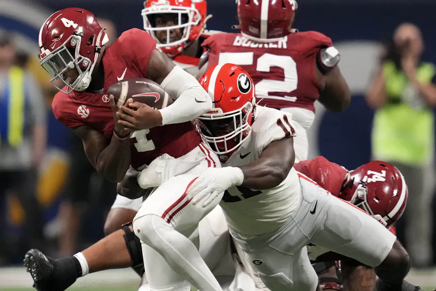 Georgia linebacker Jalon Walker sacks Alabama quarterback Jalen Milroe. We break down Georgia vs. Alabama in our Week 5 college football predictions.