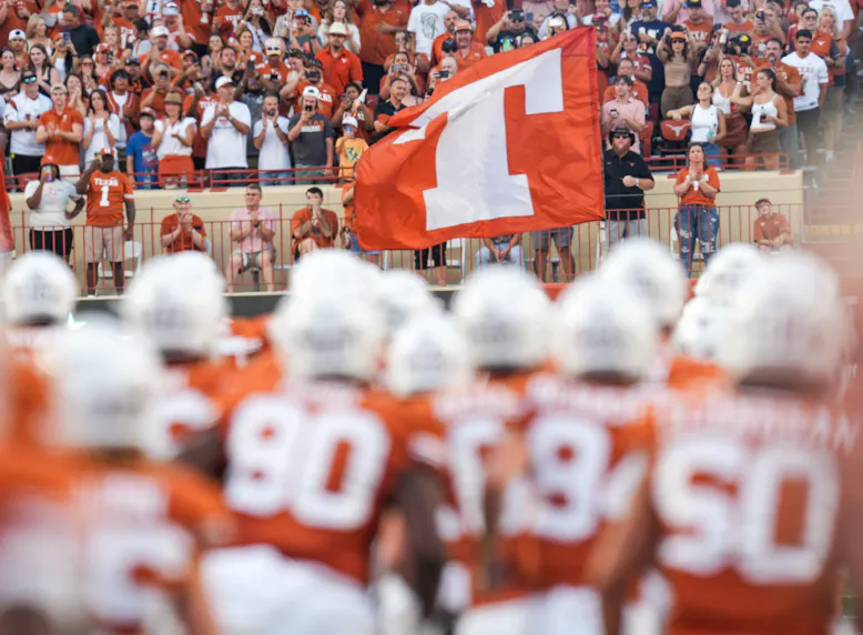 Athletes take the field as the Texas Longhorns prepare to face ULM.