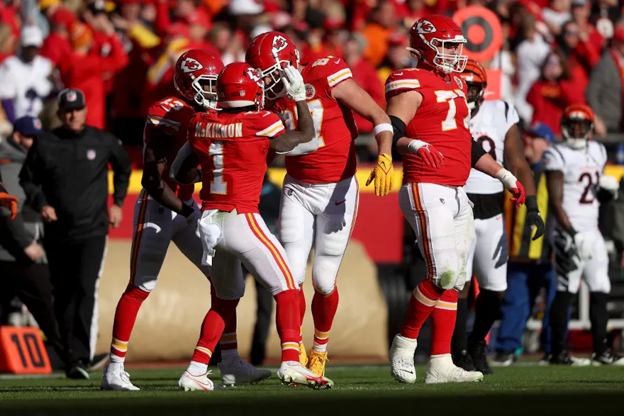 Tight end Travis Kelce and running back Jerick McKinnon celebrate a touchdown as we share our favorite Lions vs. Chiefs SGP pick.