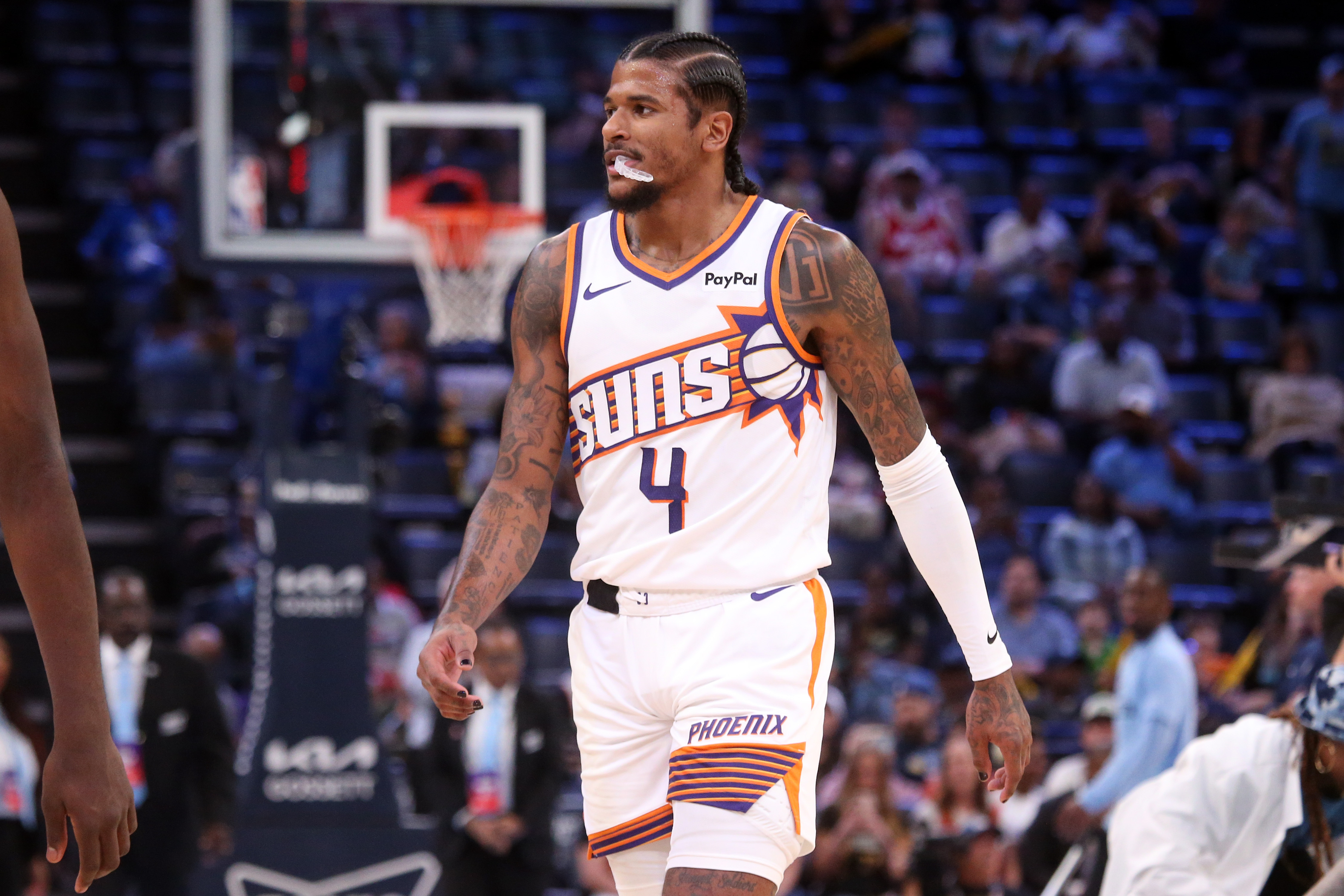 Phoenix Suns guard Jalen Green (4), seen here walking to the bench during a game, is featured in our Warriors vs. Suns prediction.