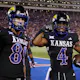 Running back Devin Neal of the Kansas Jayhawks celebrates with tight end Mason Fairchild after a touchdown as we look at our BetRivers promo code for Kansas-UNLV.