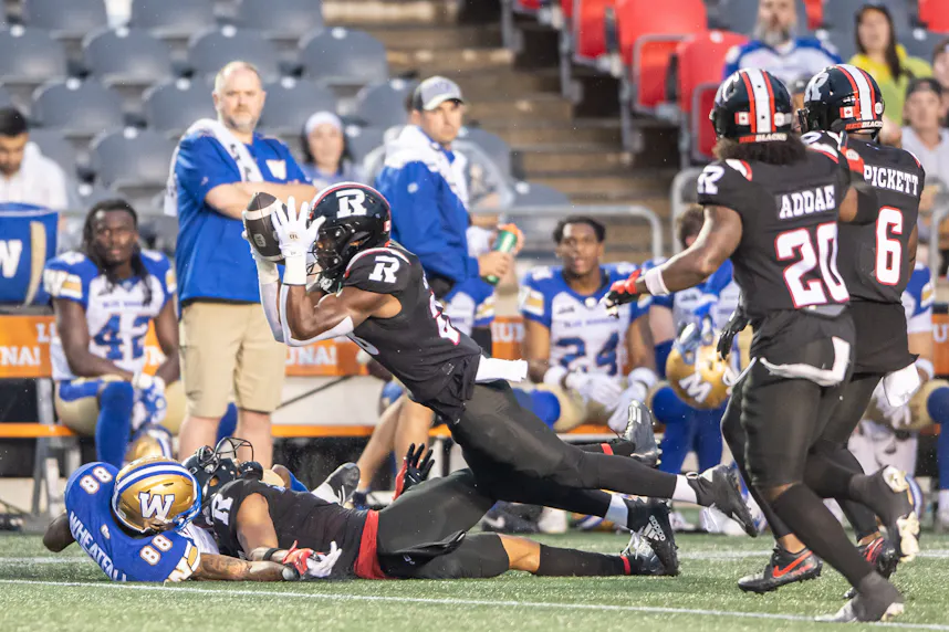 Ottawa Redblacks linebacker Frankie Griffin intercepts the ball against the Winnipeg Blue Bombers. We're expecting defense to lead the way in our Argonauts vs. Redblacks prediction.