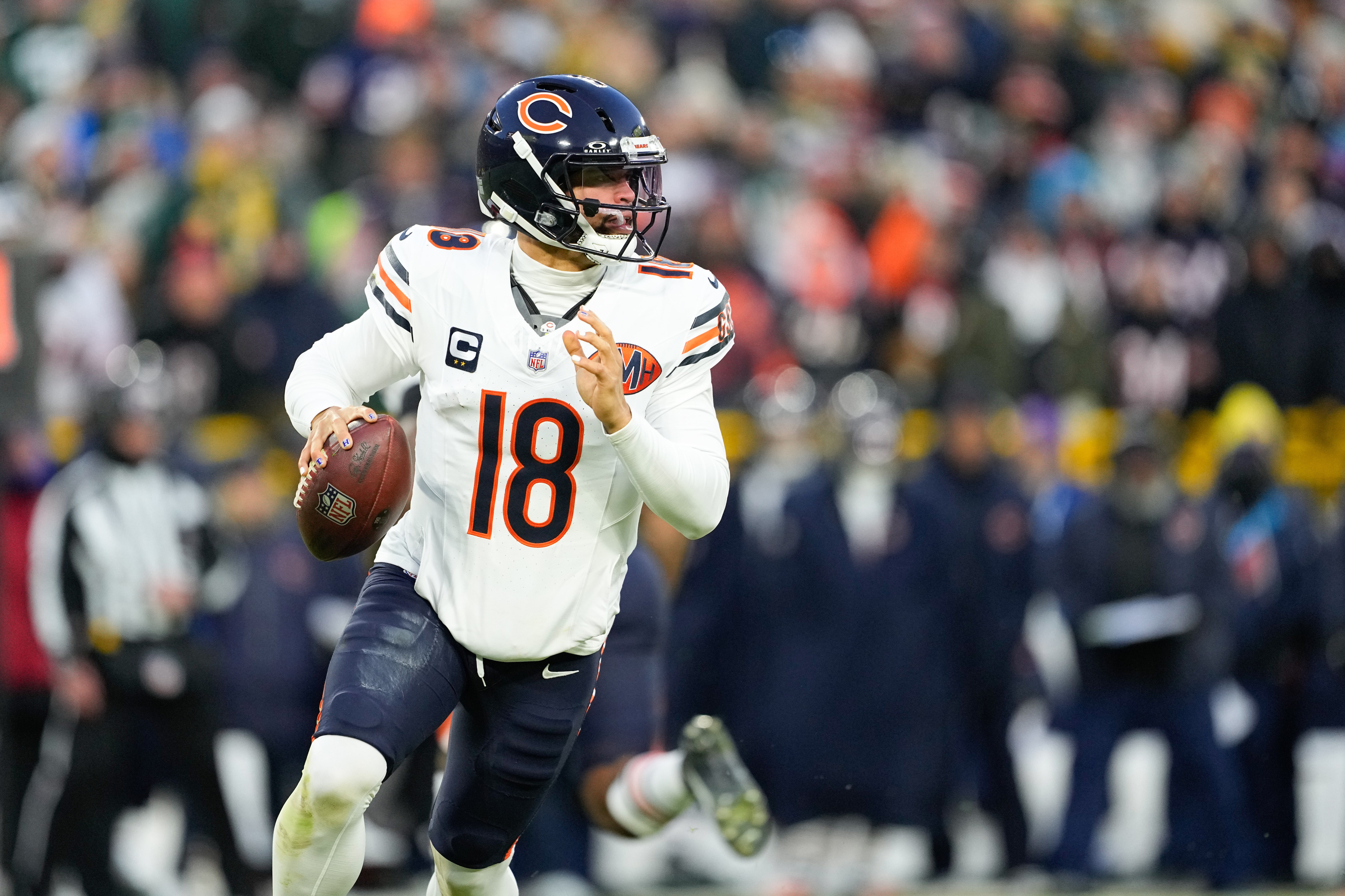 Chicago Bears quarterback Caleb Williams (18) looks to throw as we offer our Rams vs. Bears player props for the Divisional Round.