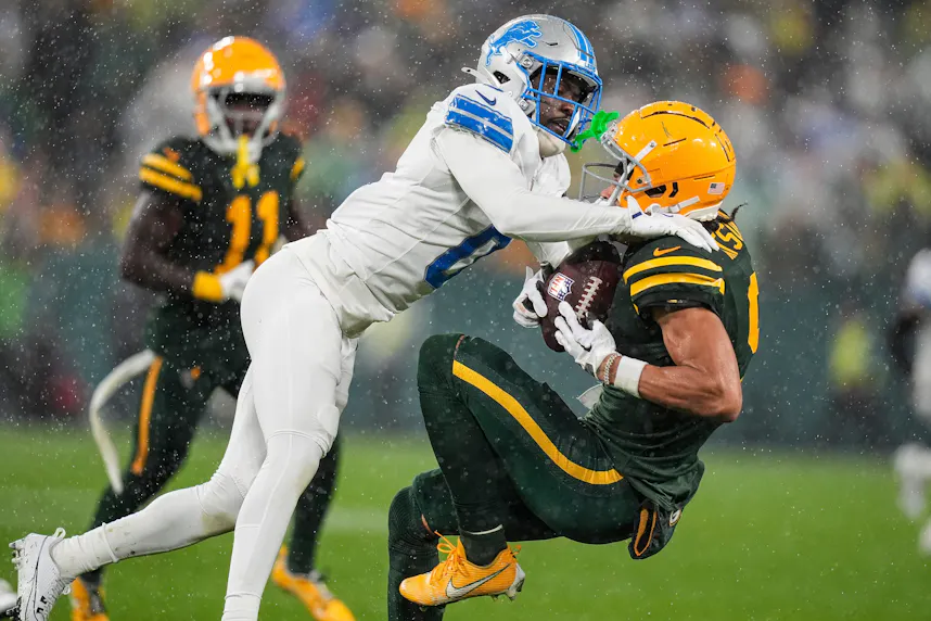 Detroit Lions cornerback Terrion Arnold tackles Green Bay Packers wide receiver Christian Watson as we make our Packers vs. Lions TNF early picks.