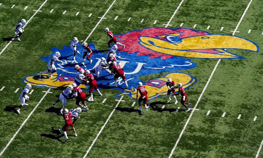 The Kansas Jayhawks offense runs the ball against the Duke Blue Devils defense during the first half at David Booth Kansas Memorial Stadium on Sept. 24.