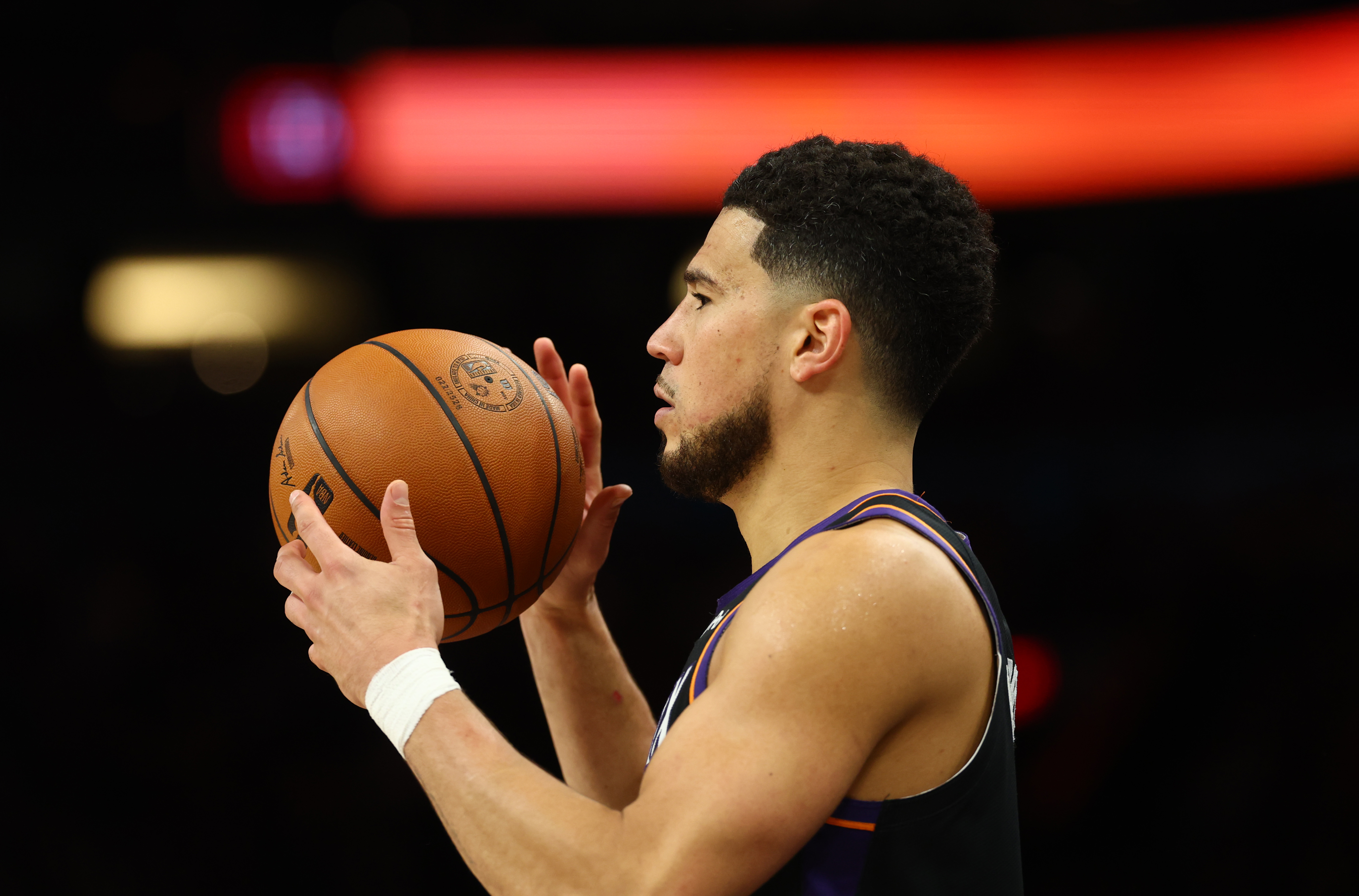 Phoenix Suns guard Devin Booker (1) looks on as we break down the 2026-27 NBA Play-In Tournament odds.
