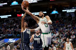 Jayson Tatum of the Boston Celtics drives to the basket against Jaden Hardy and Luka Doncic of the Dallas Mavericks in the second half at American Airlines Center. We're backing Tatum in our Mavericks vs. Celtics Parlay. 